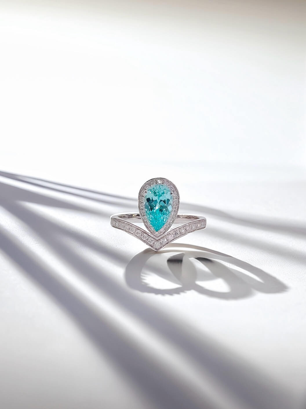 Halo setting pear cut  lab grown Paraiba engagement ring