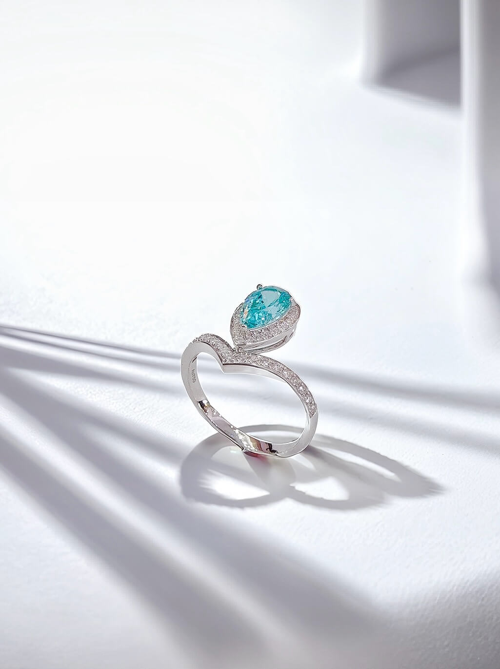 Halo setting pear cut  lab grown Paraiba engagement ring