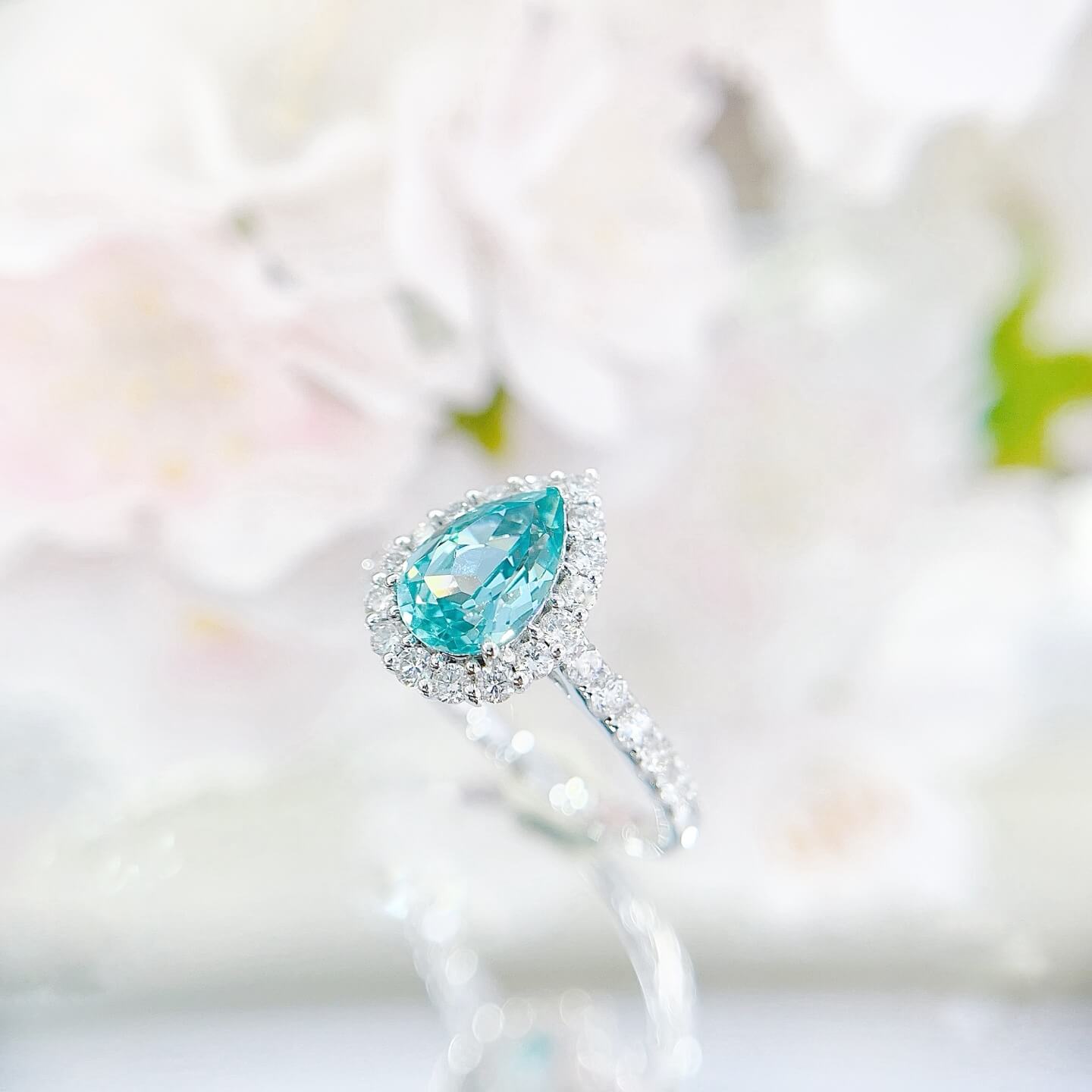 Halo setting pear cut  lab grown Paraiba engagement ring
