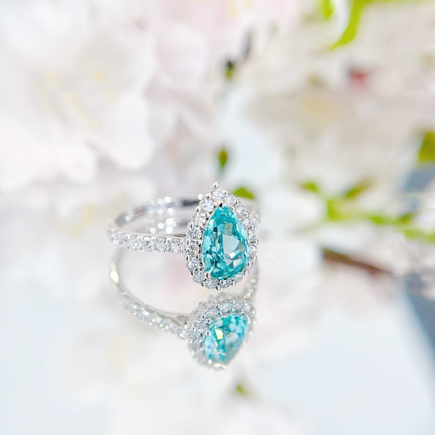 Halo setting pear cut  lab grown Paraiba engagement ring