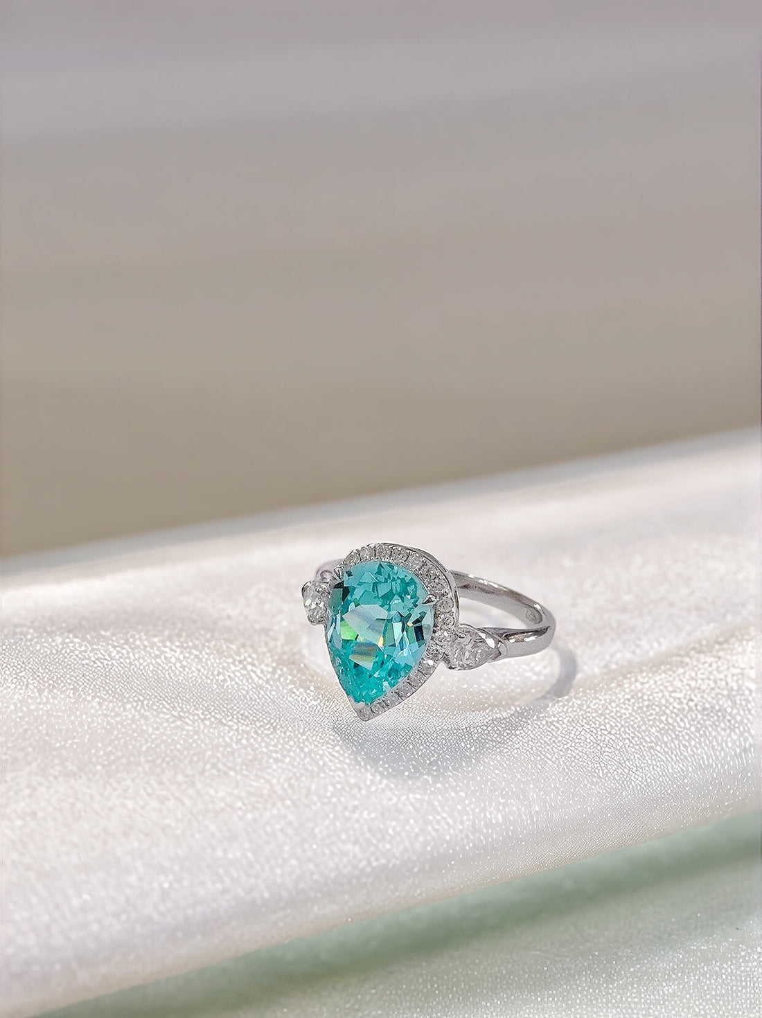 Halo setting pear cut  lab grown Paraiba engagement ring