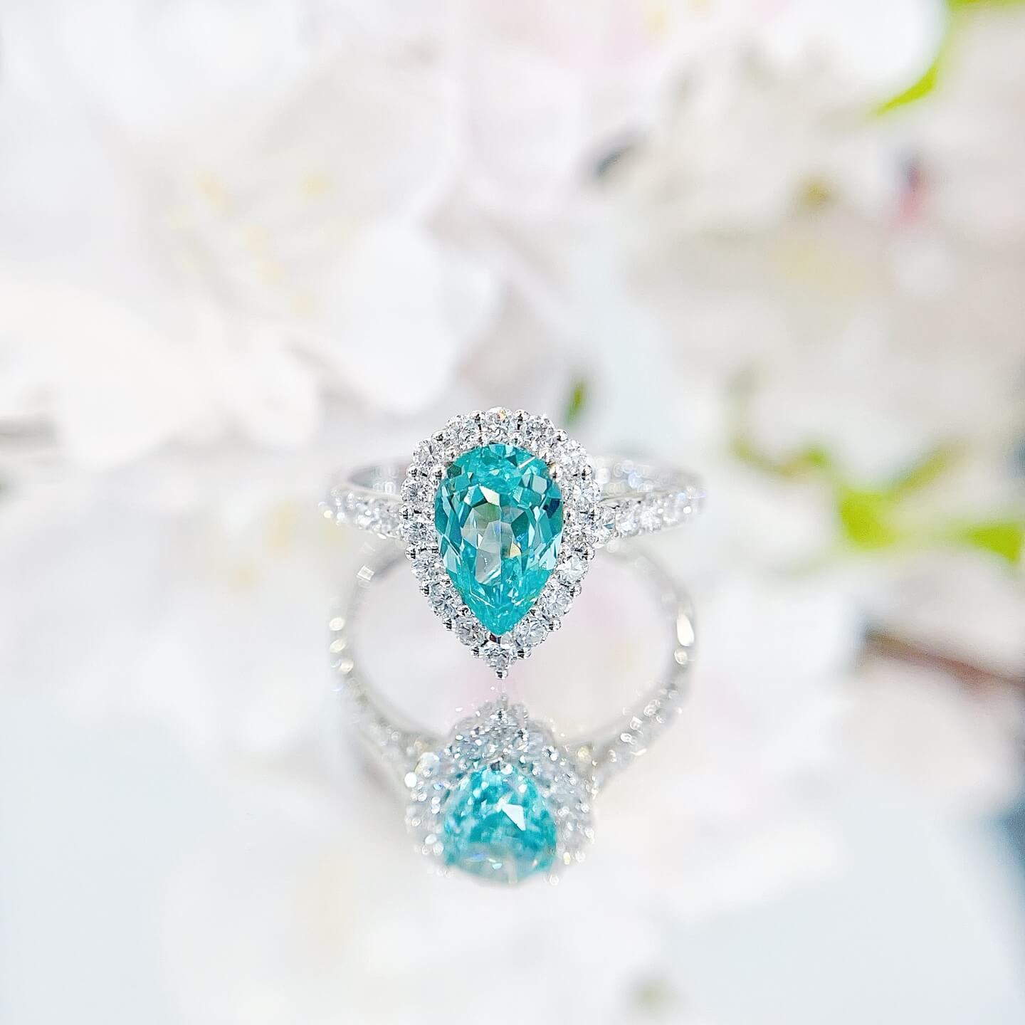 Halo setting pear cut  lab grown Paraiba engagement ring
