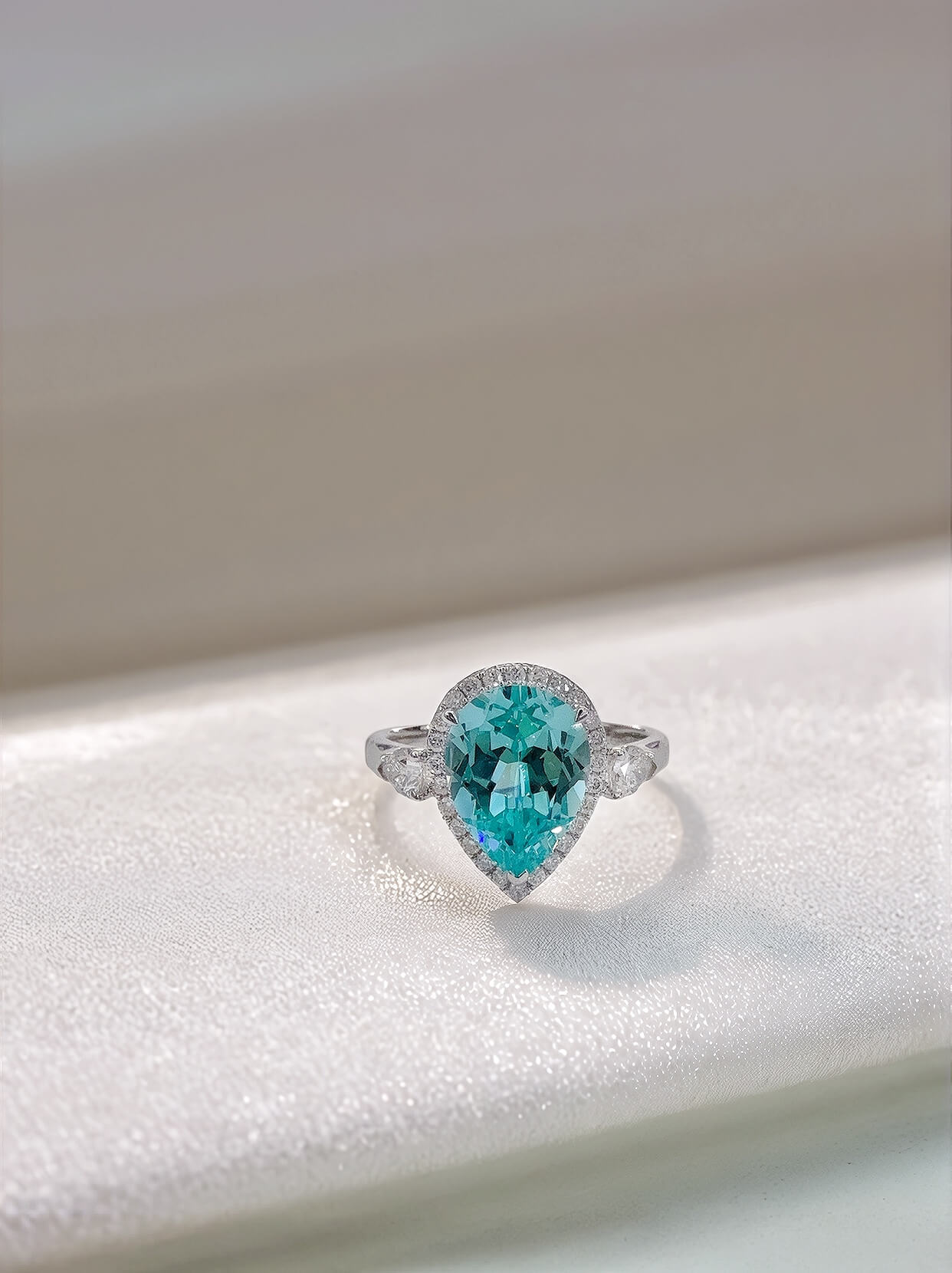 Halo setting pear cut  lab grown Paraiba engagement ring