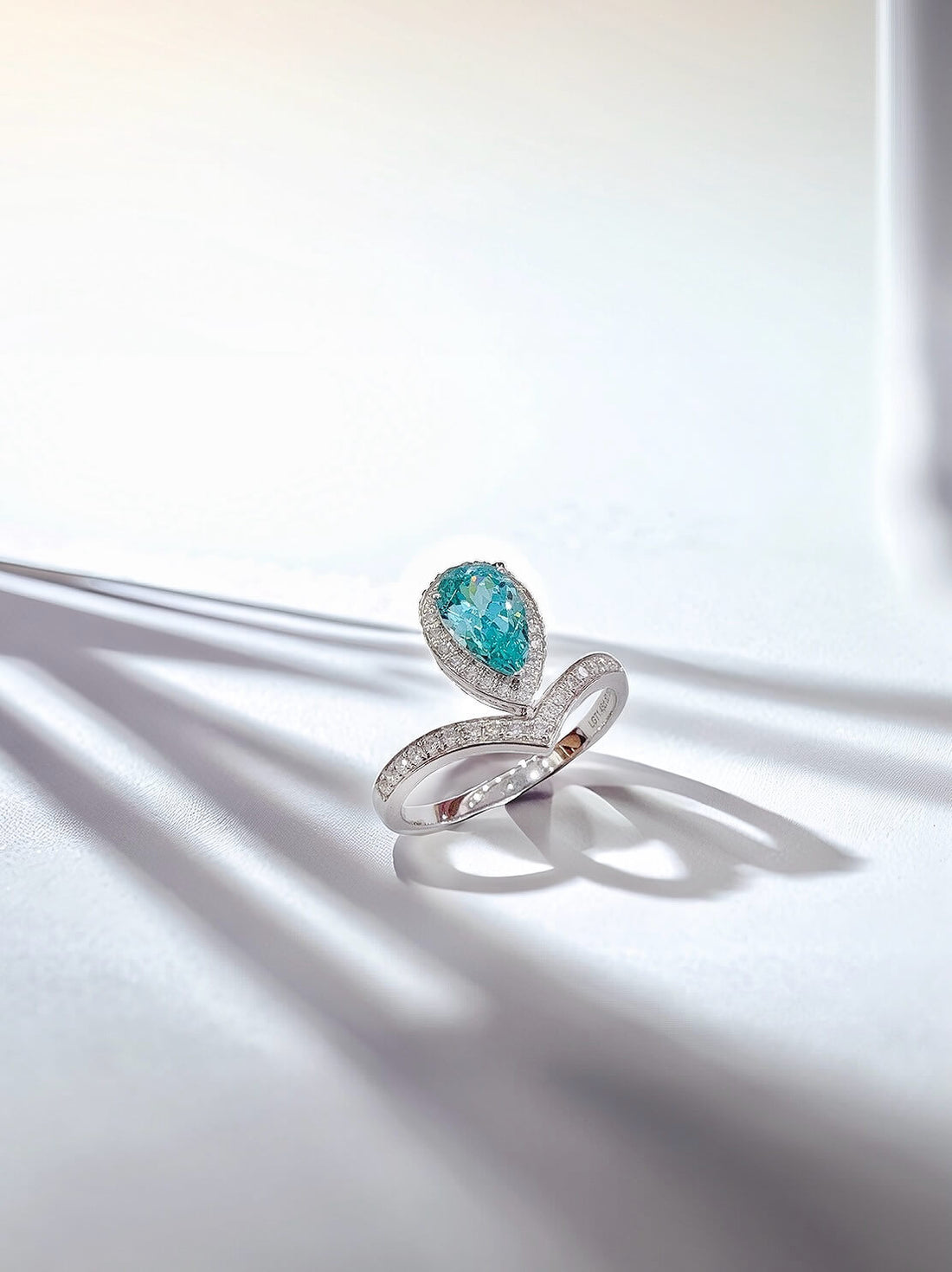 Halo setting pear cut  lab grown Paraiba engagement ring