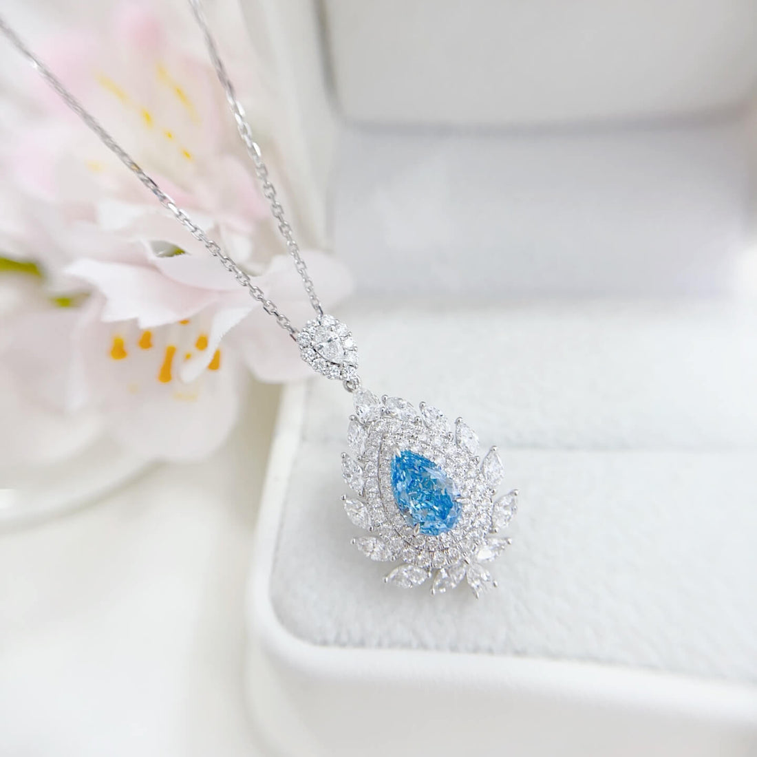 Halo setting pear cut lab grown blue diamond necklace