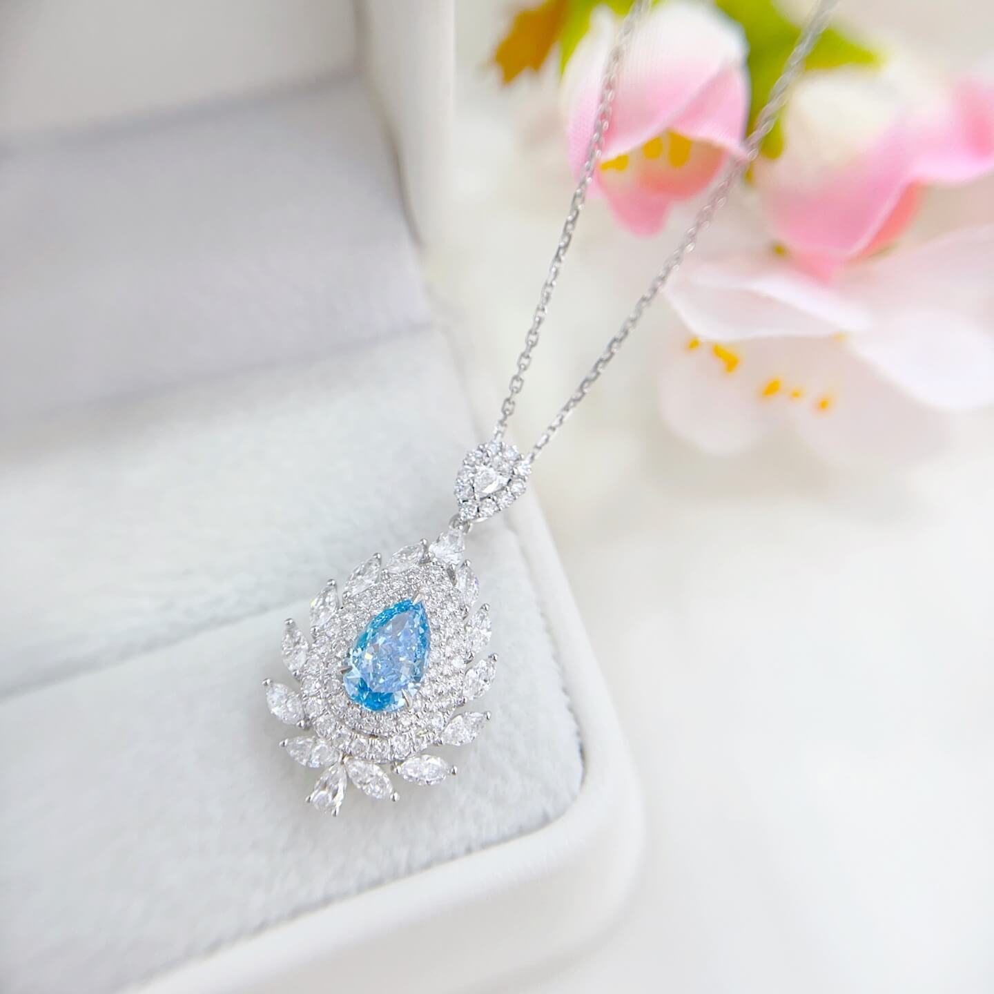 Halo setting pear cut lab grown blue diamond necklace