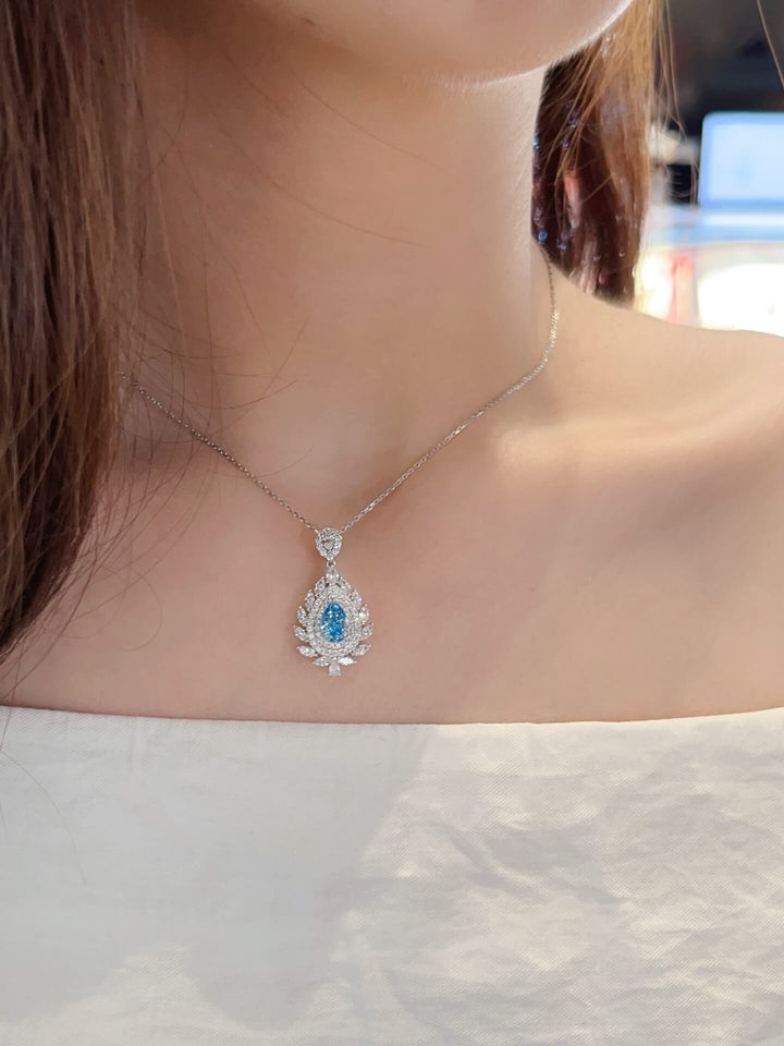 Halo setting pear cut lab grown blue diamond necklace