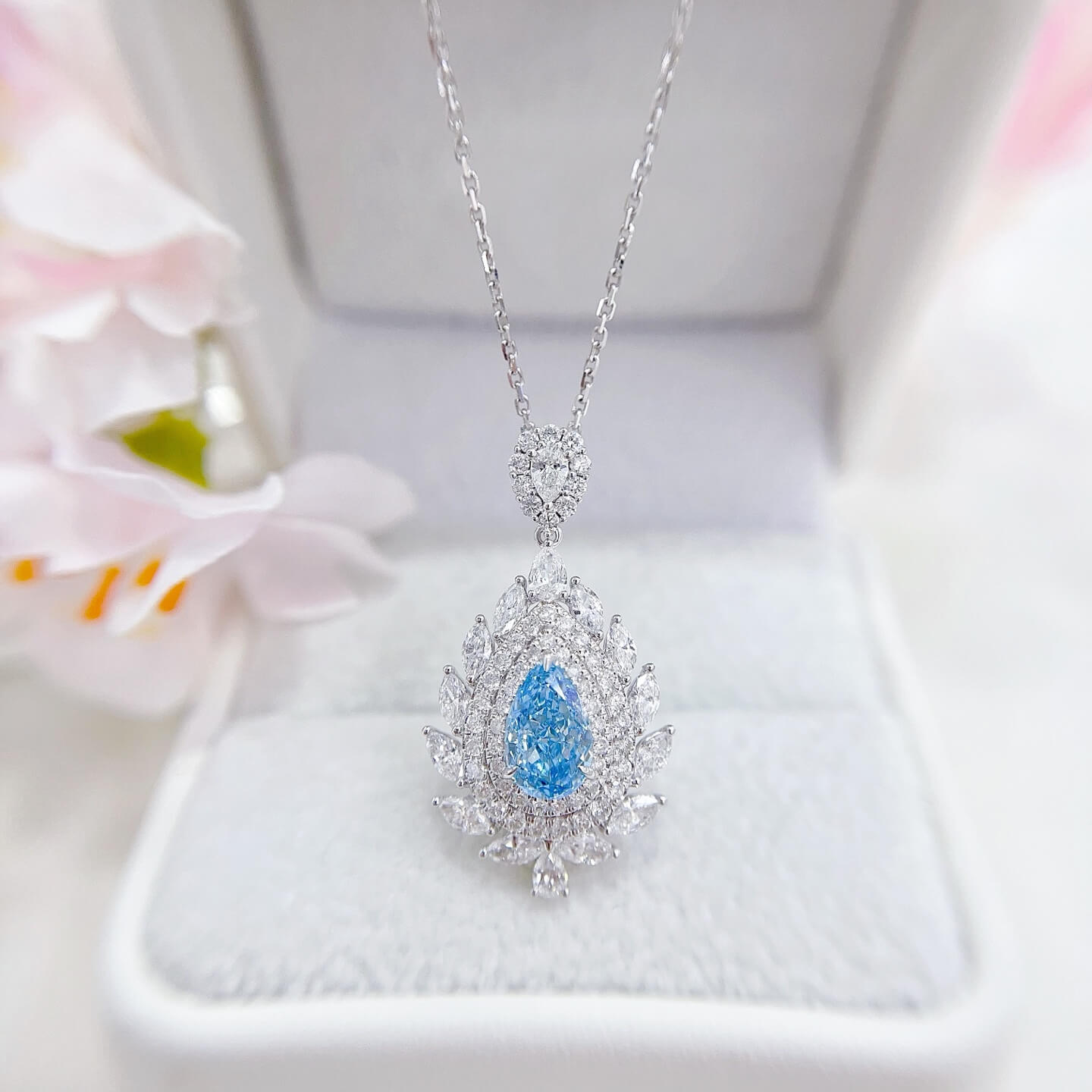 Halo setting pear cut lab grown blue diamond necklace