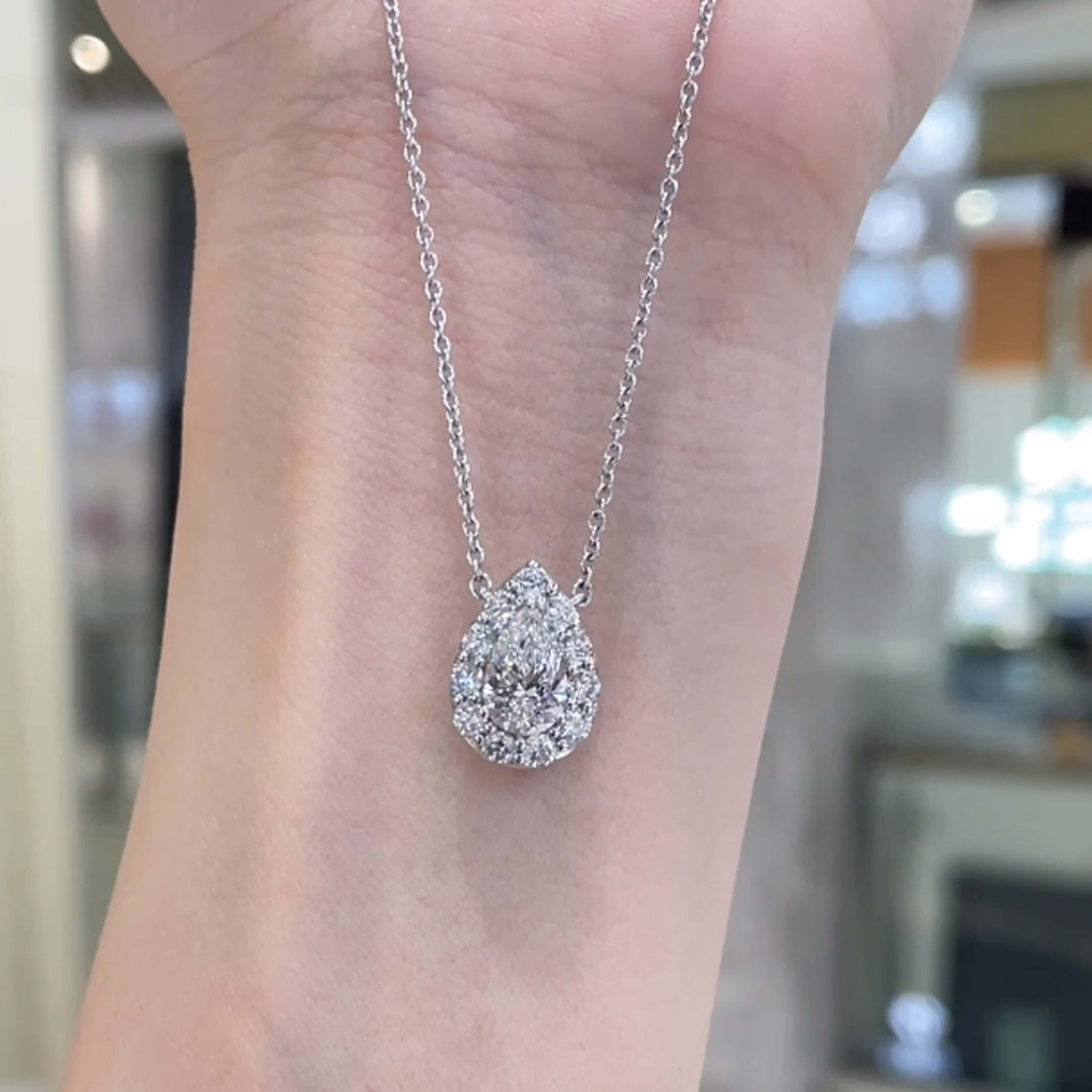 Halo setting pear cut lab grown diamond pendant necklace