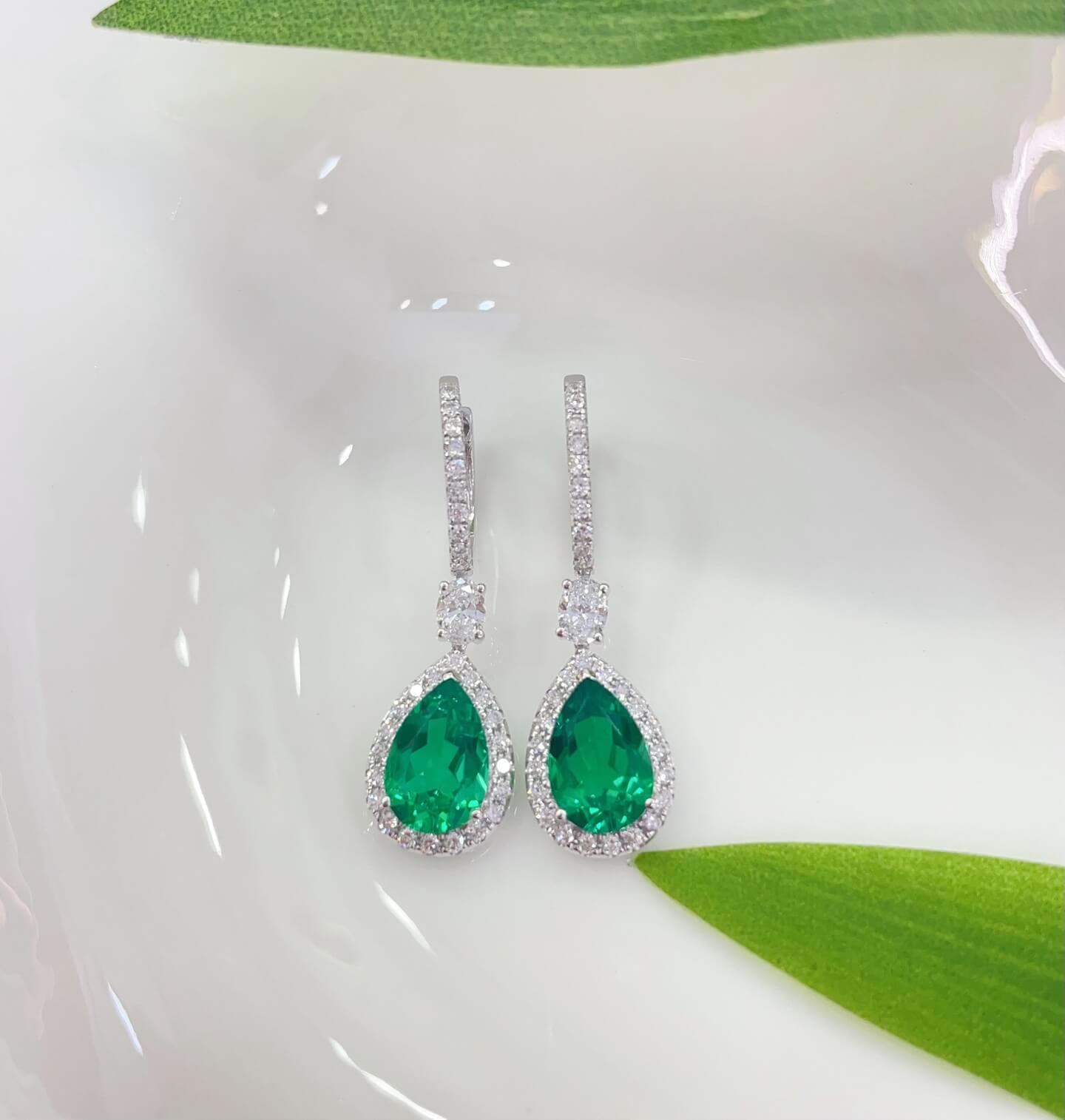 Halo setting pear cut lab grown emerald hoop earrings
