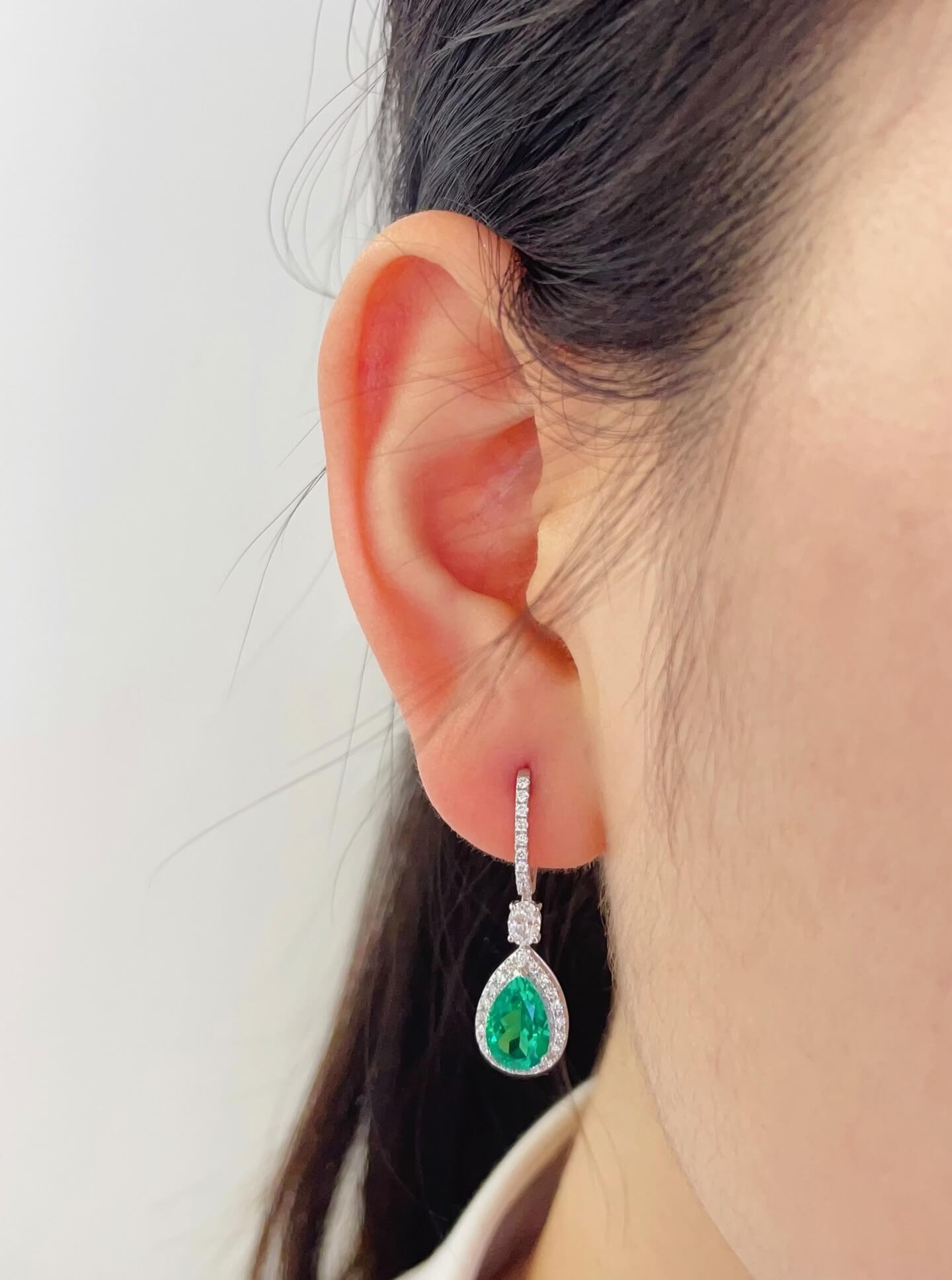 Halo setting pear cut lab grown emerald hoop earrings