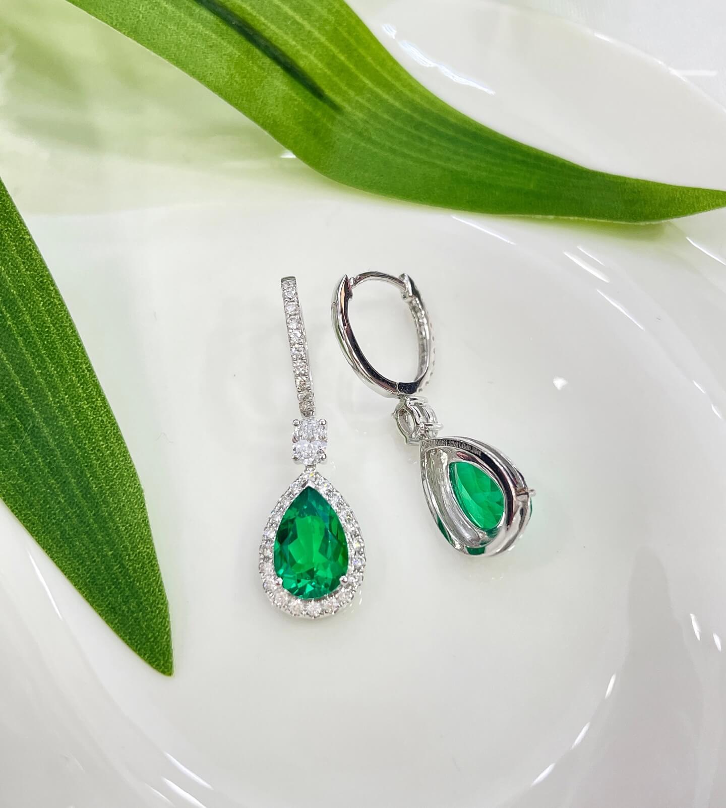 Halo setting pear cut lab grown emerald hoop earrings