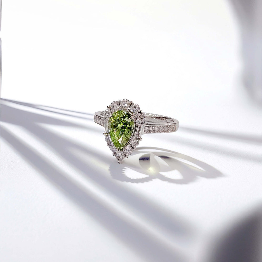 Halo setting pear cut lab grown green diamond engagement ring