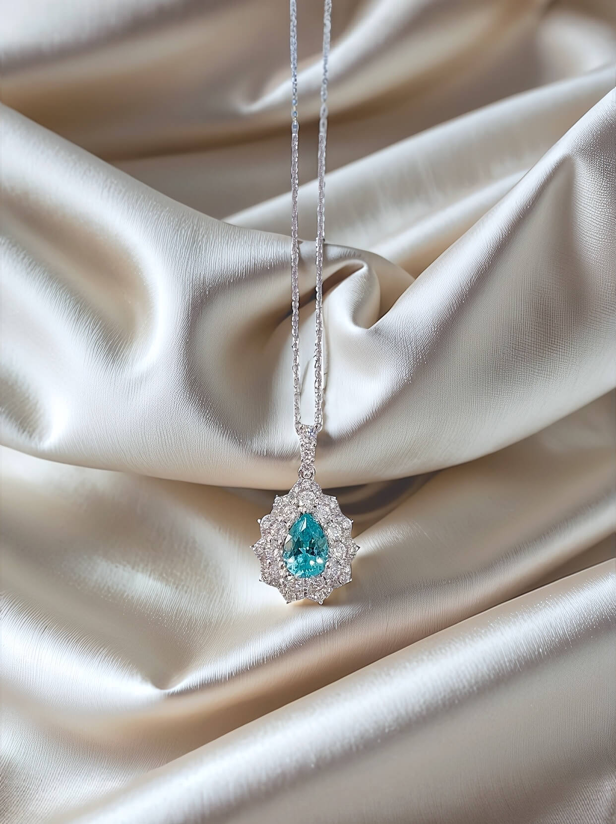 Halo setting pear cut lab grown paraiba pendant necklace
