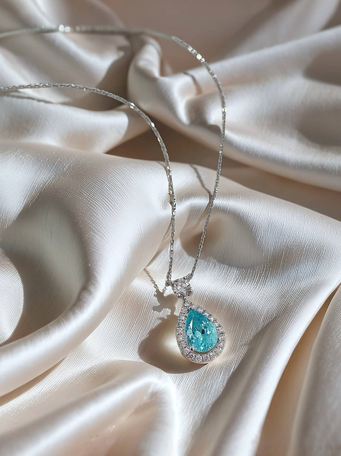 Halo setting pear cut lab grown paraiba pendant necklace