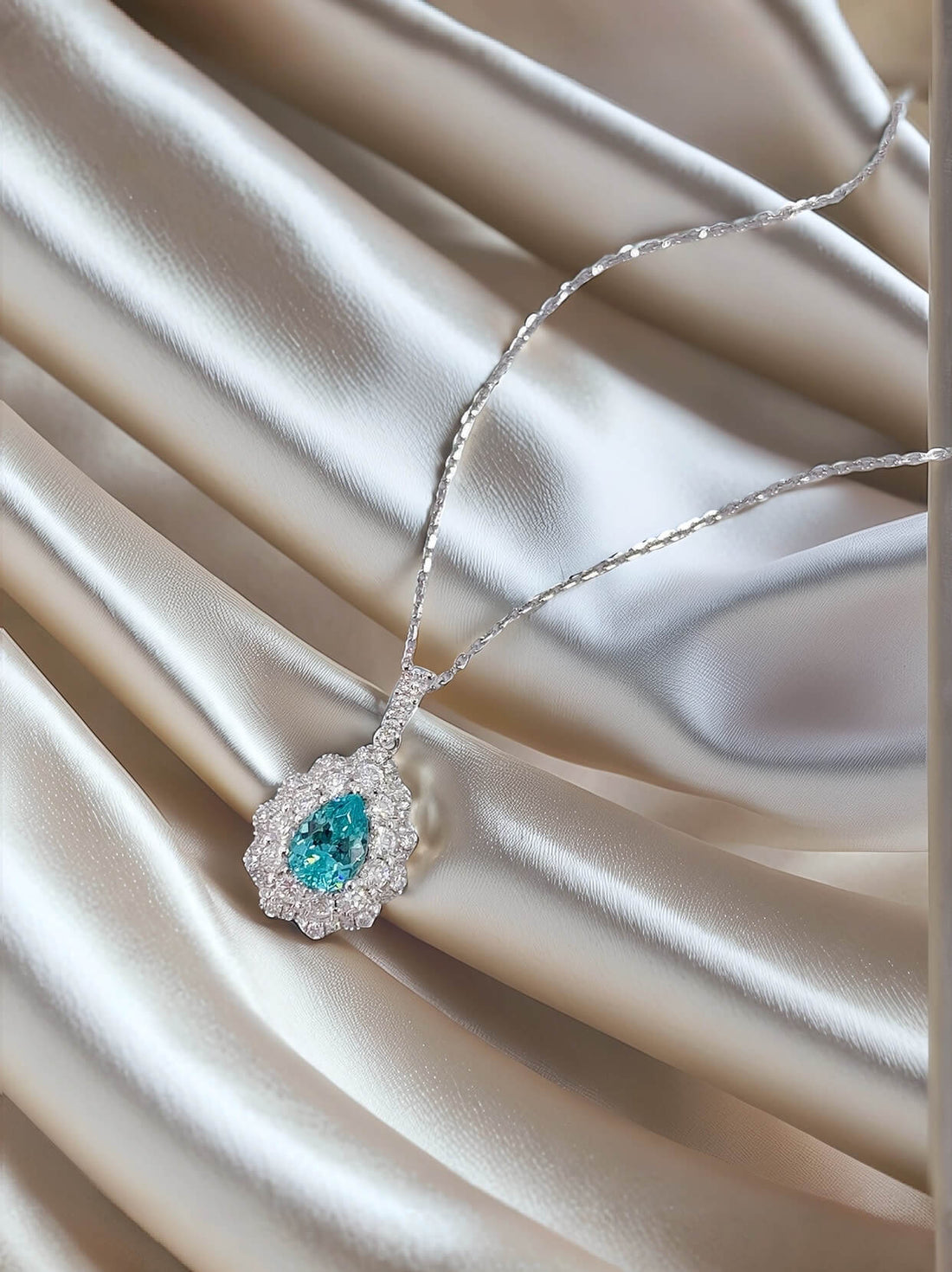 Halo setting pear cut lab grown paraiba pendant necklace