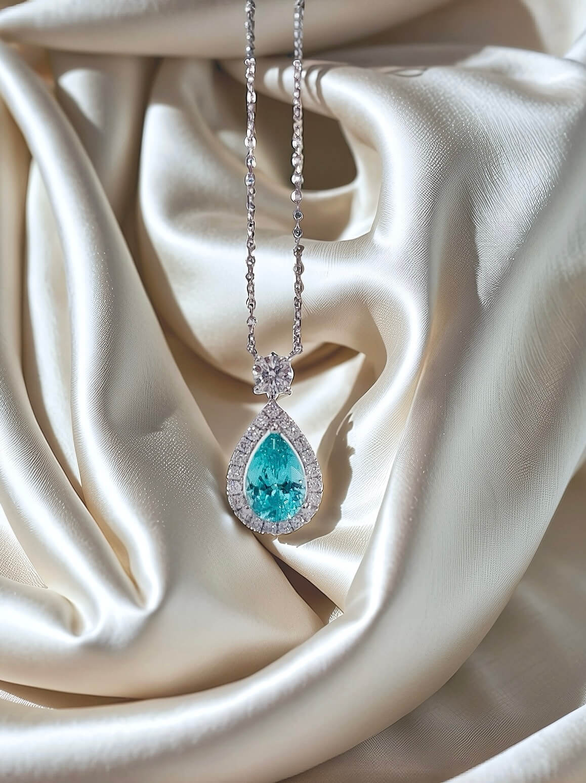 Halo setting pear cut lab grown paraiba pendant necklace