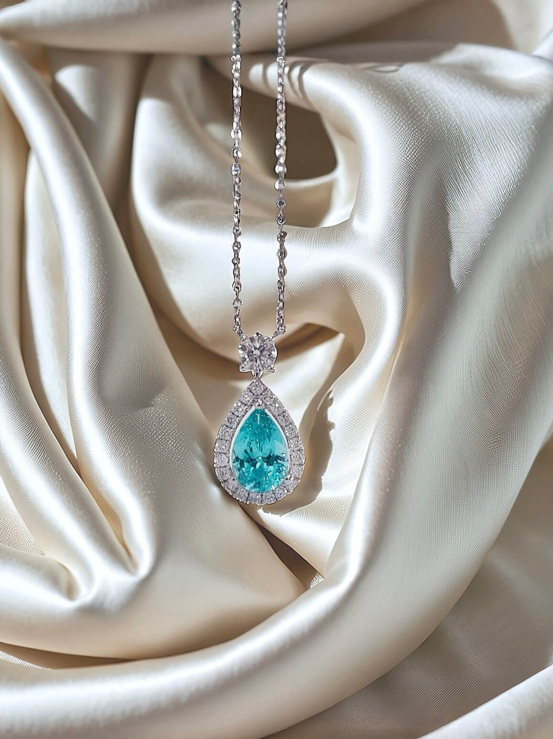 Halo setting pear cut lab grown paraiba pendant necklace