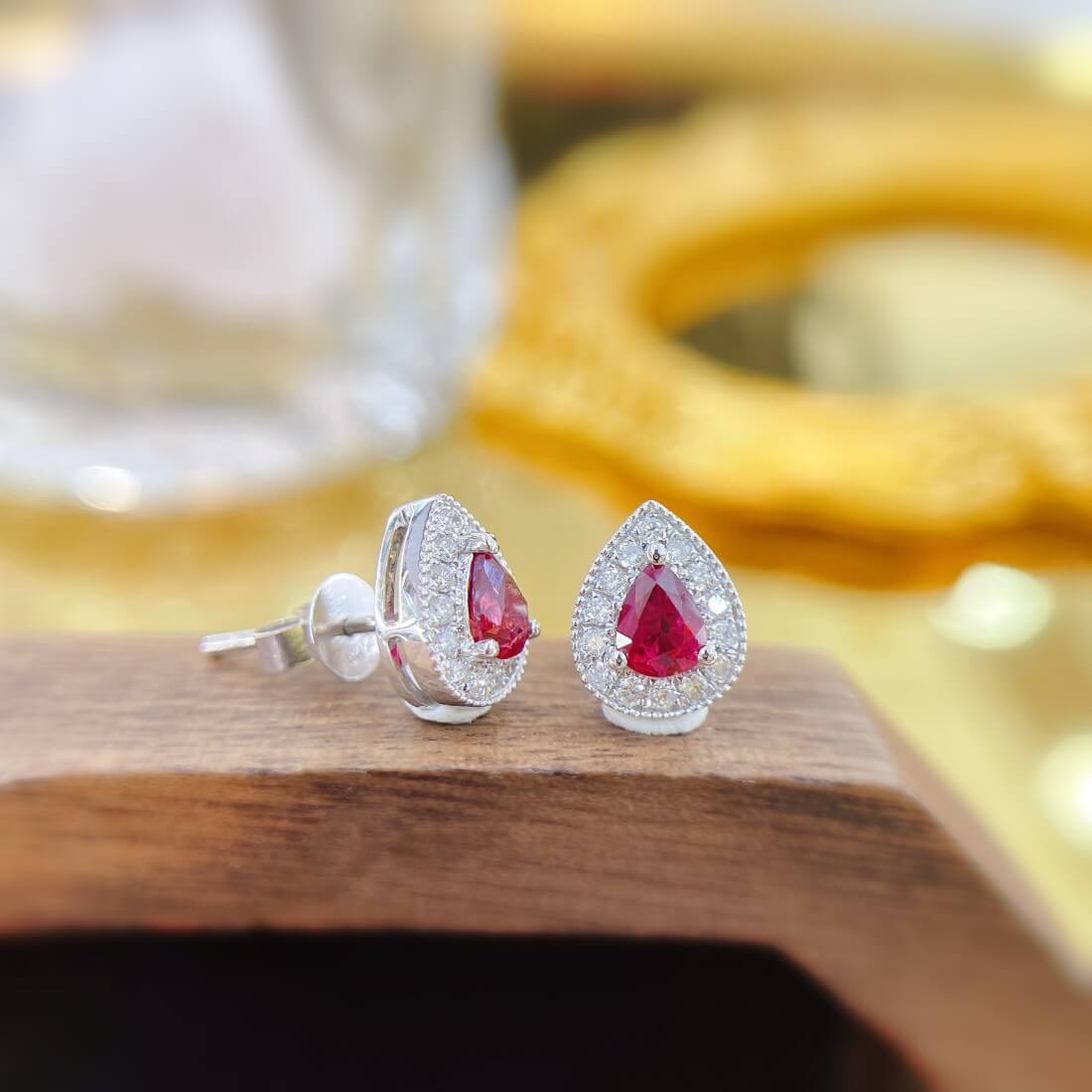 Halo setting pear cut lab grown ruby earrings stud