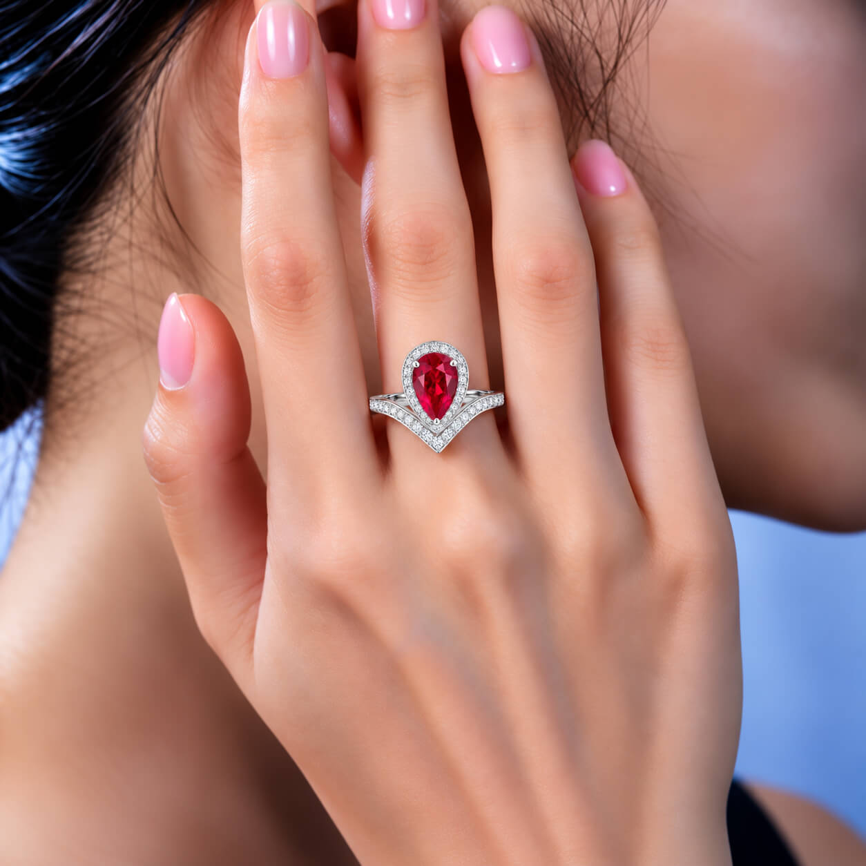 Halo setting pear cut lab grown ruby engagement ring