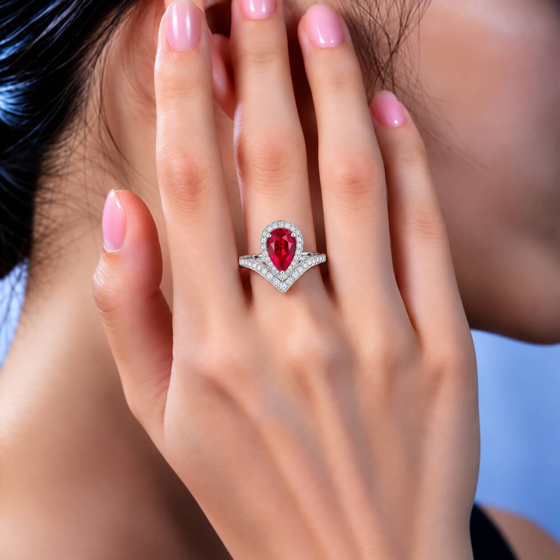 Halo setting pear cut lab grown ruby engagement ring