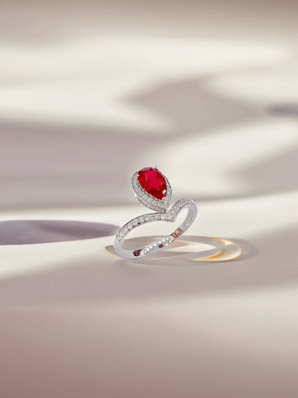 Halo setting pear cut lab grown ruby engagement ring