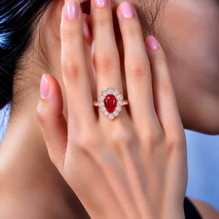 Halo setting pear cut lab grown ruby engagement ring