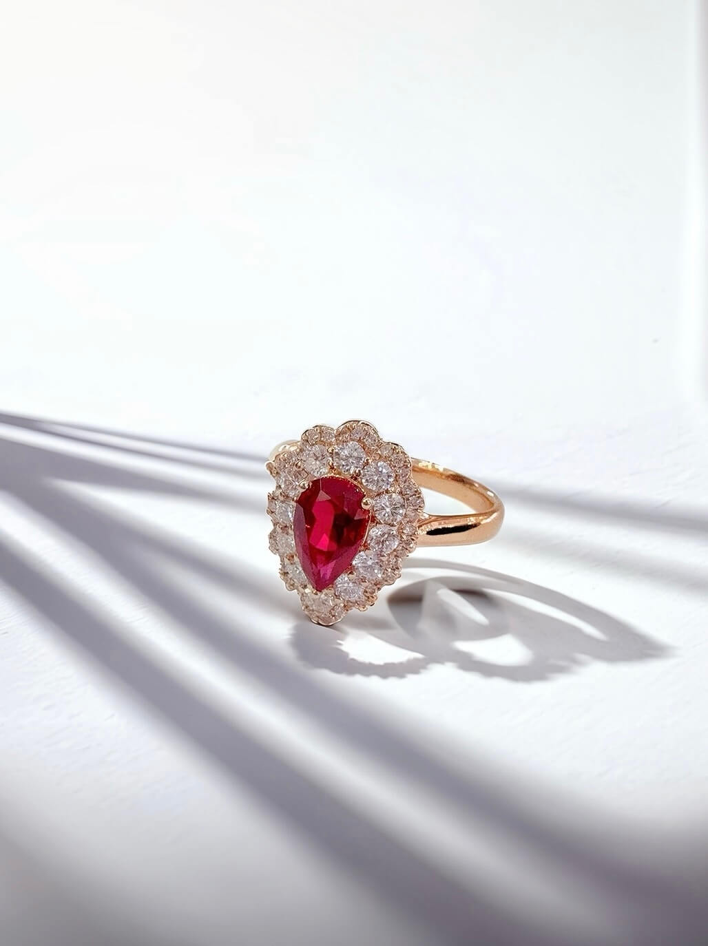 Halo setting pear cut lab grown ruby engagement ring
