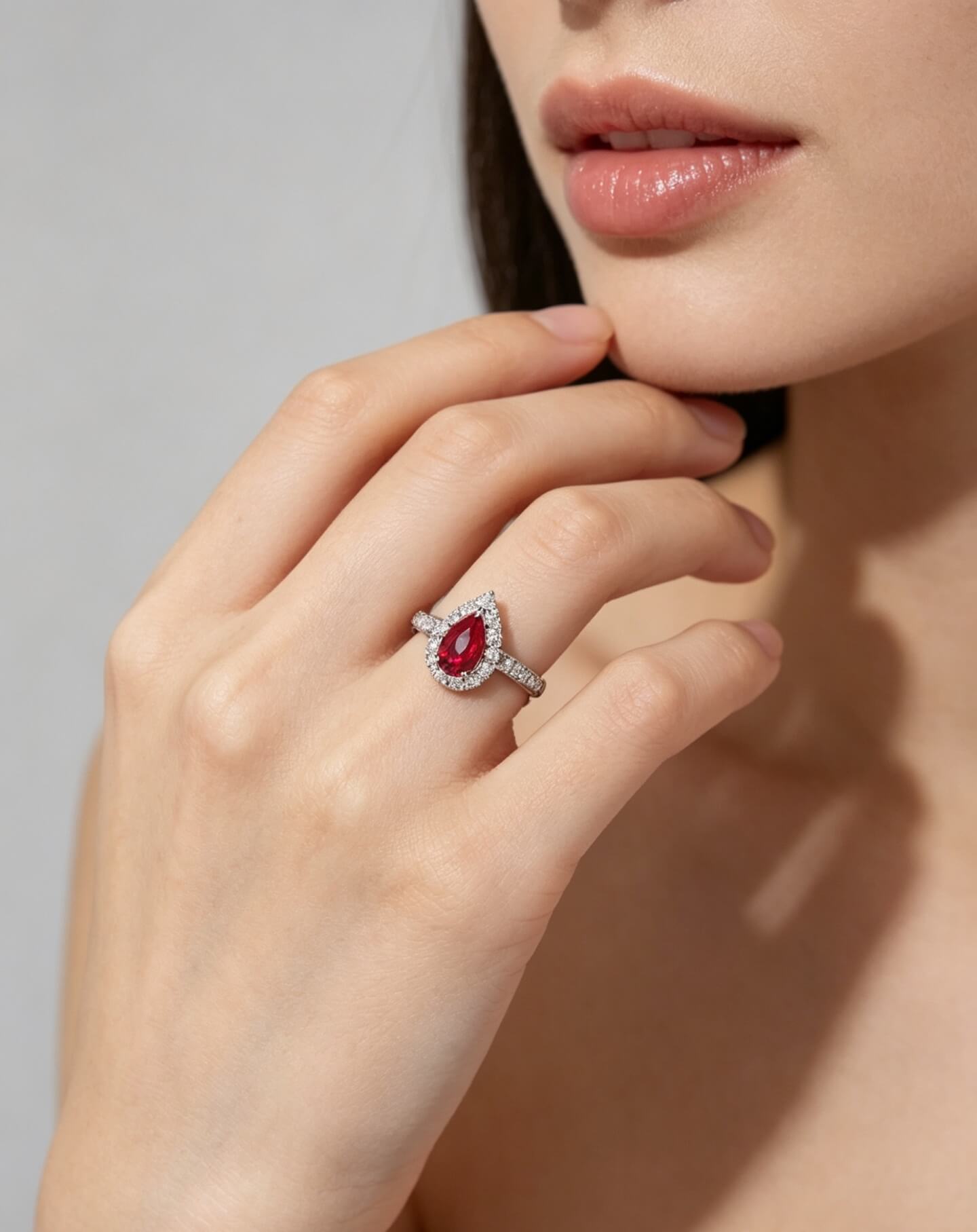 Halo setting pear cut lab grown ruby engagement ring