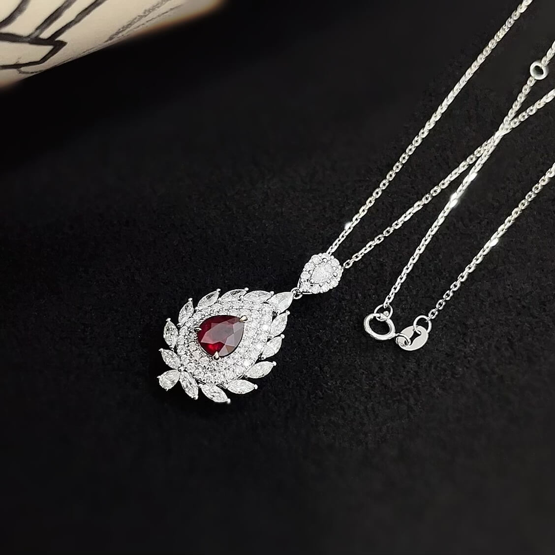 Halo setting pear cut lab grown ruby pendant necklace