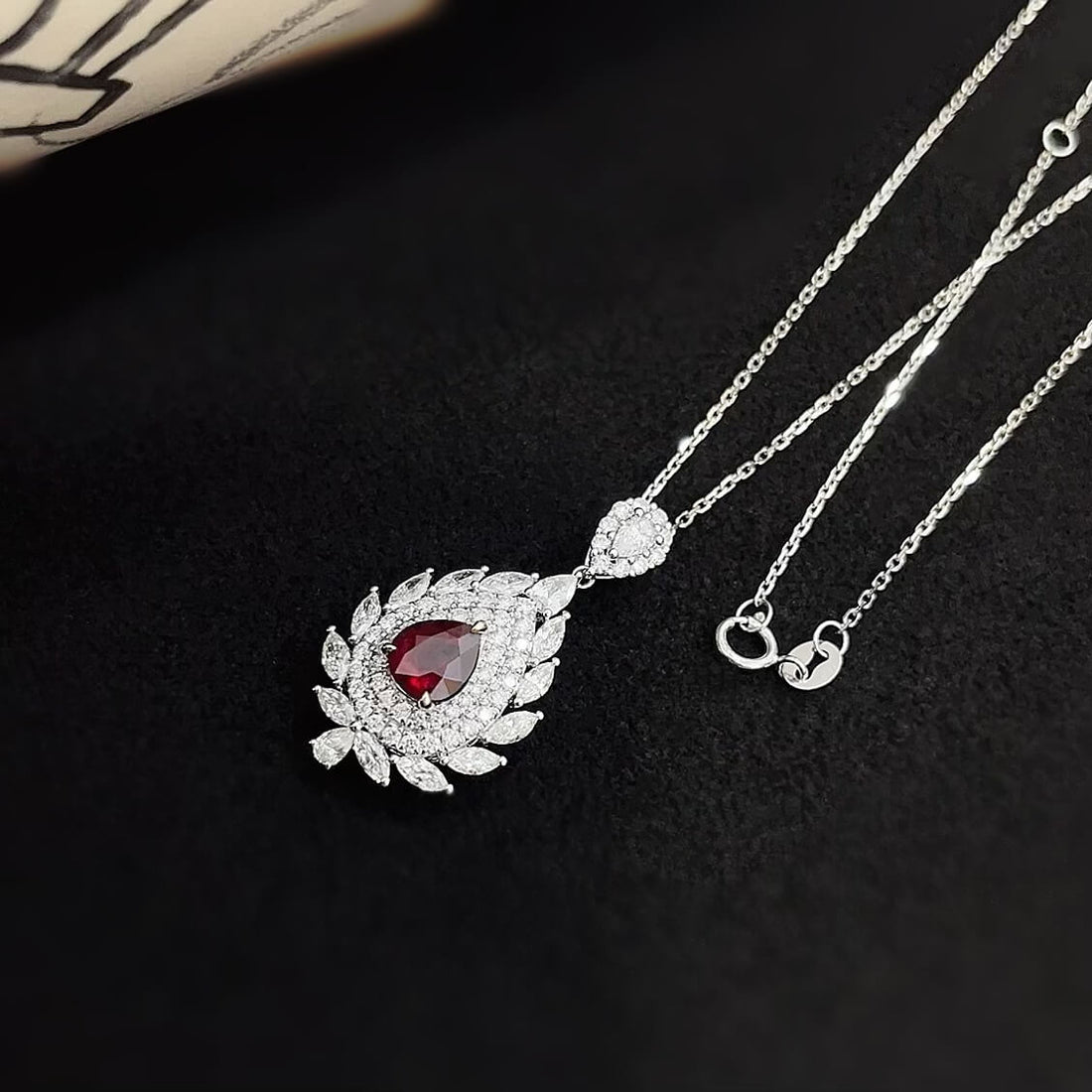 Halo setting pear cut lab grown ruby pendant necklace