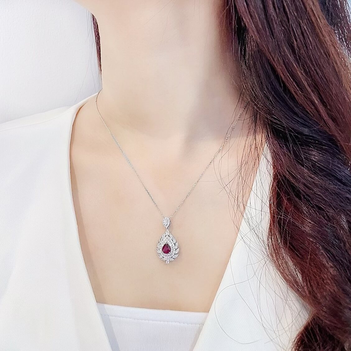 Halo setting pear cut lab grown ruby pendant necklace