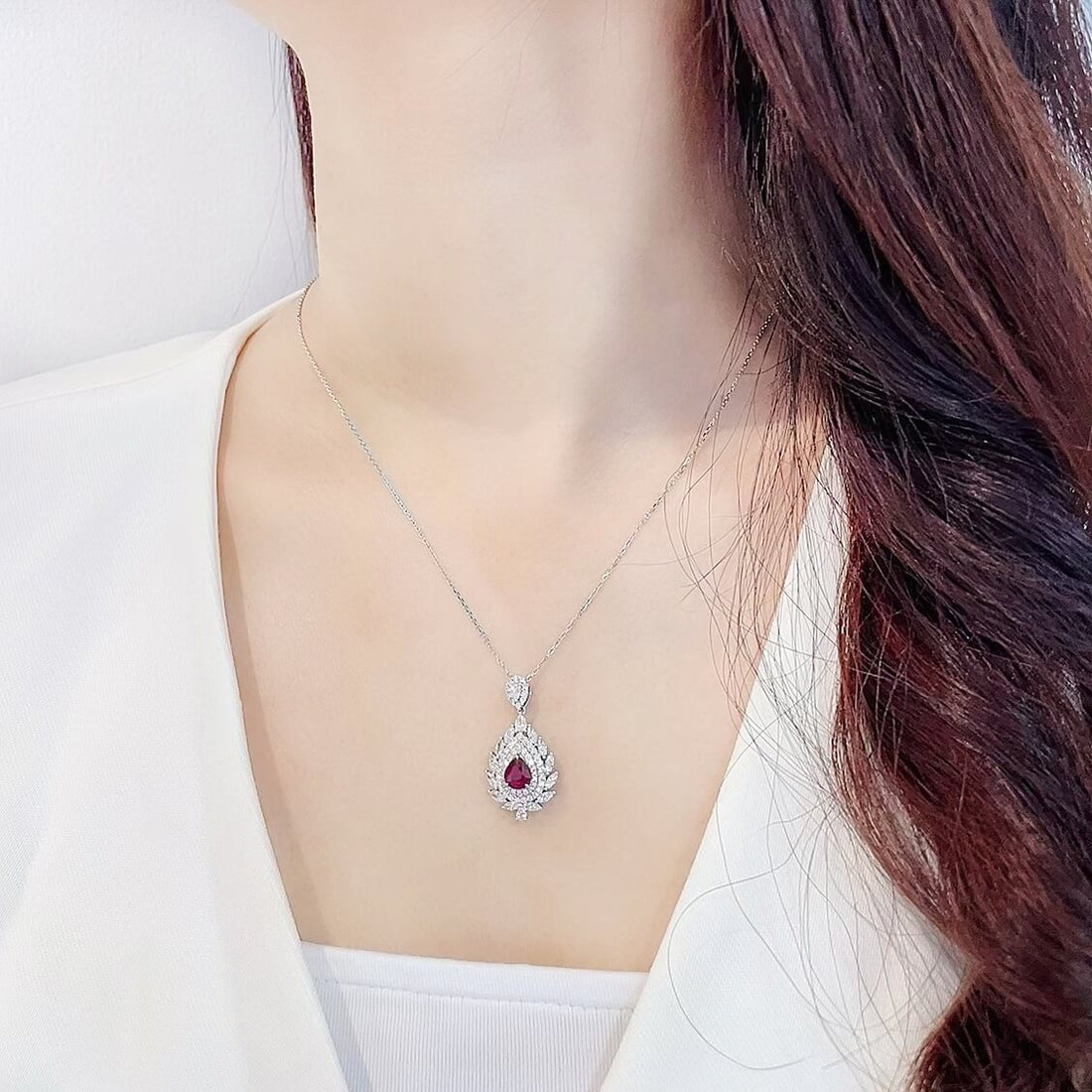 Halo setting pear cut lab grown ruby pendant necklace
