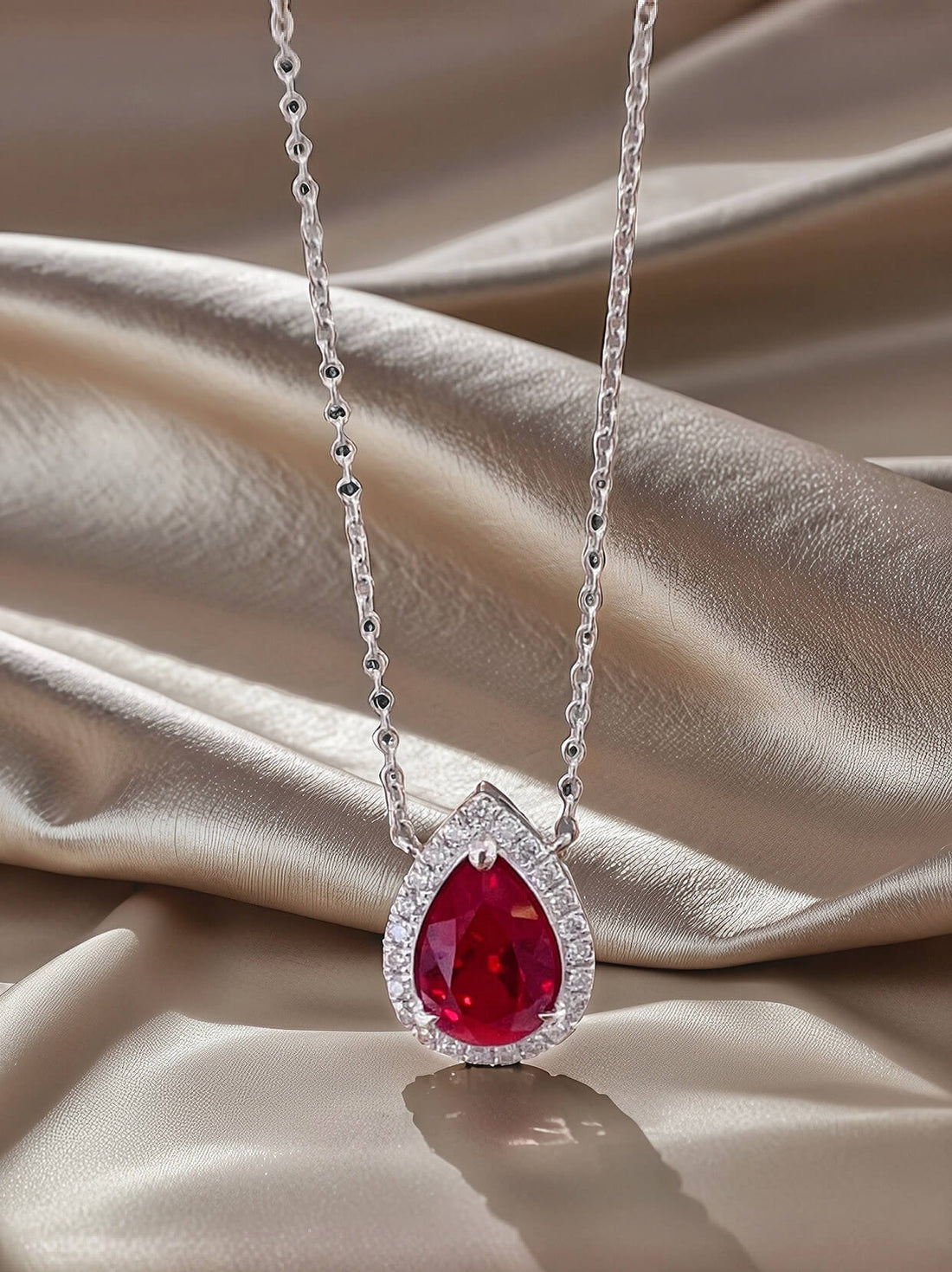 Halo setting pear cut lab grown ruby pendant necklace