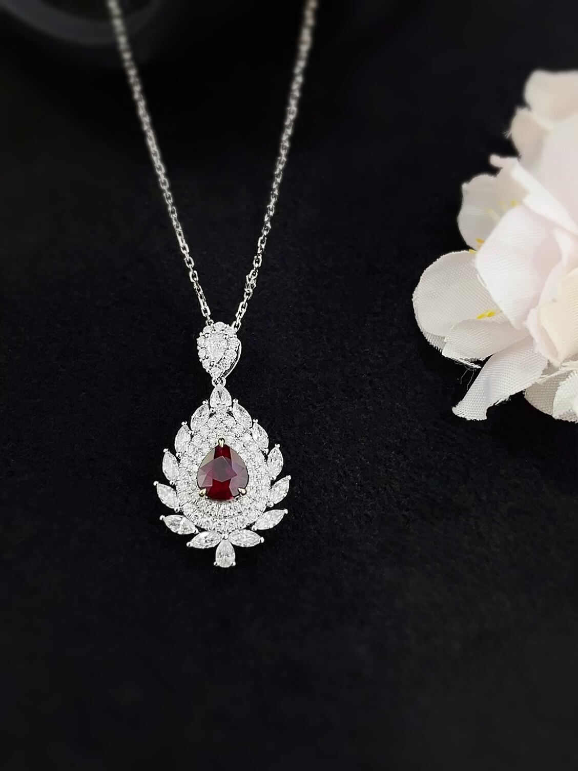 Halo setting pear cut lab grown ruby pendant necklace