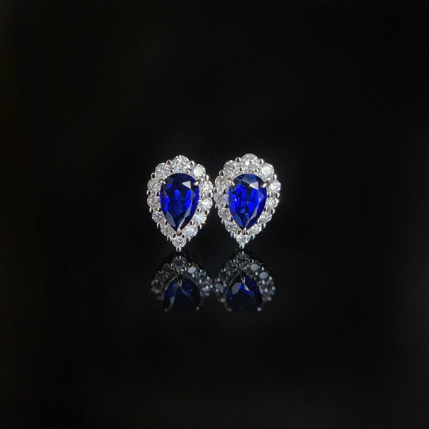 Halo setting pear cut lab grown sapphire earrings stud