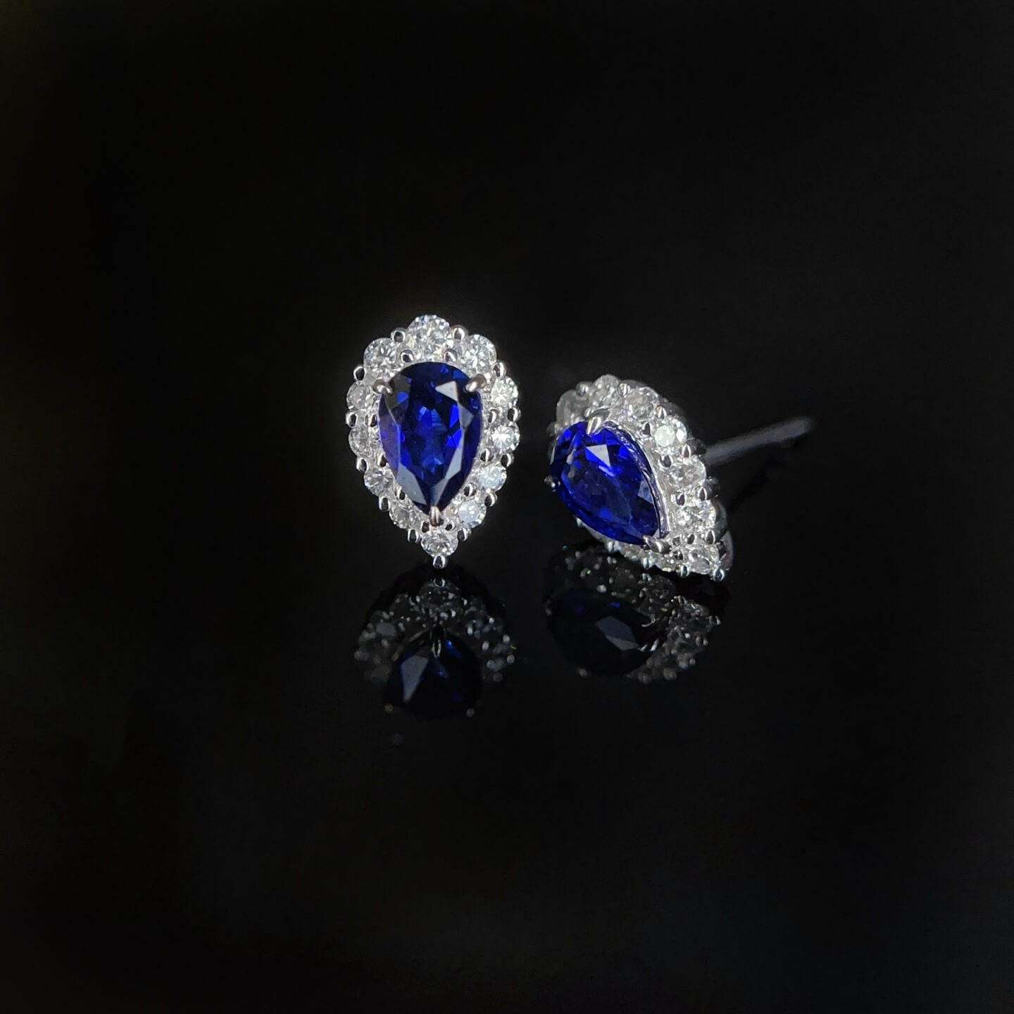 Halo setting pear cut lab grown sapphire earrings stud