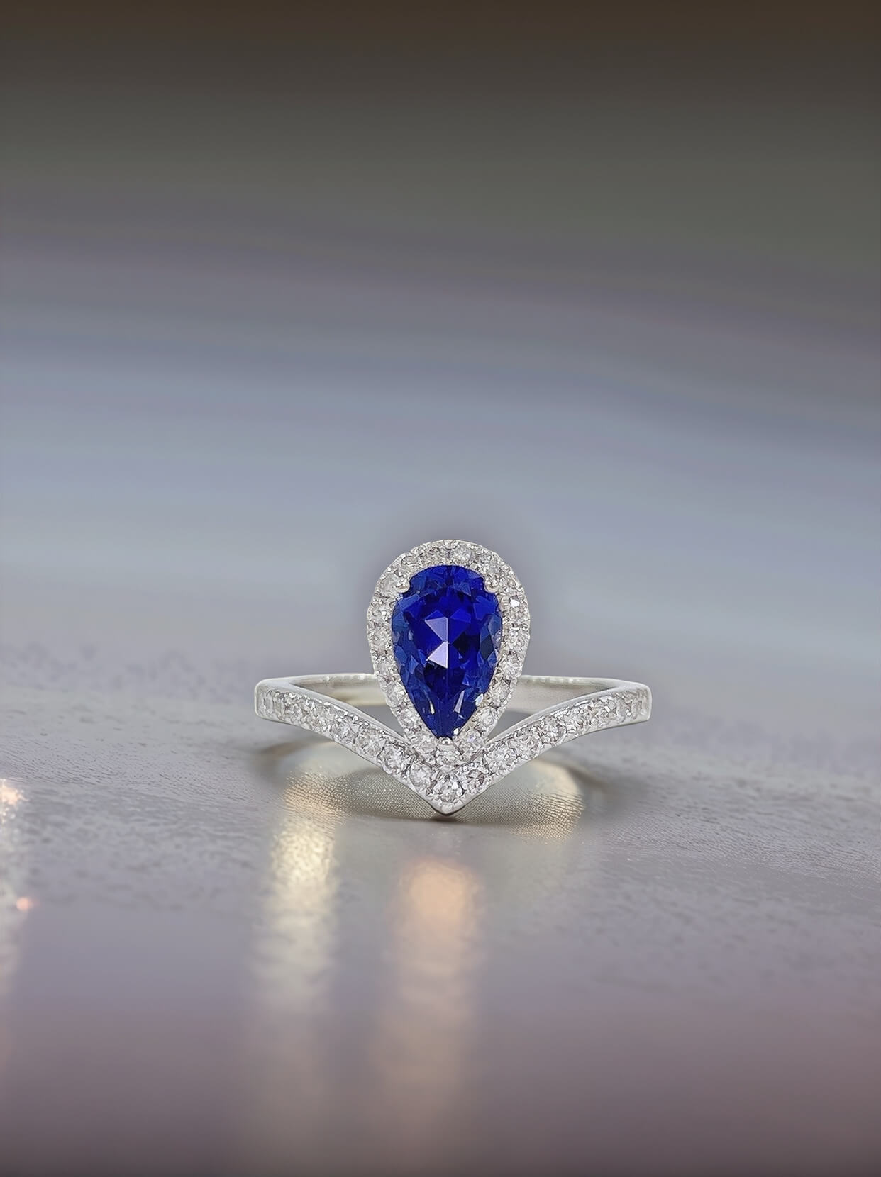 Halo setting pear cut  lab grown sapphire engagement ring