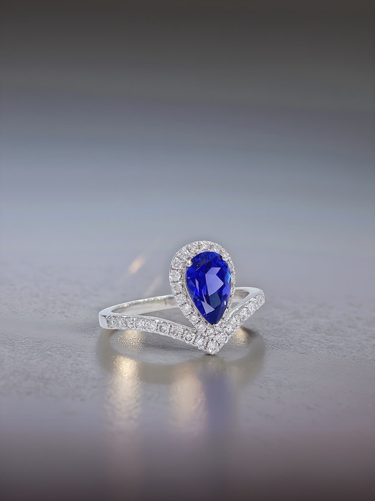 Halo setting pear cut  lab grown sapphire engagement ring