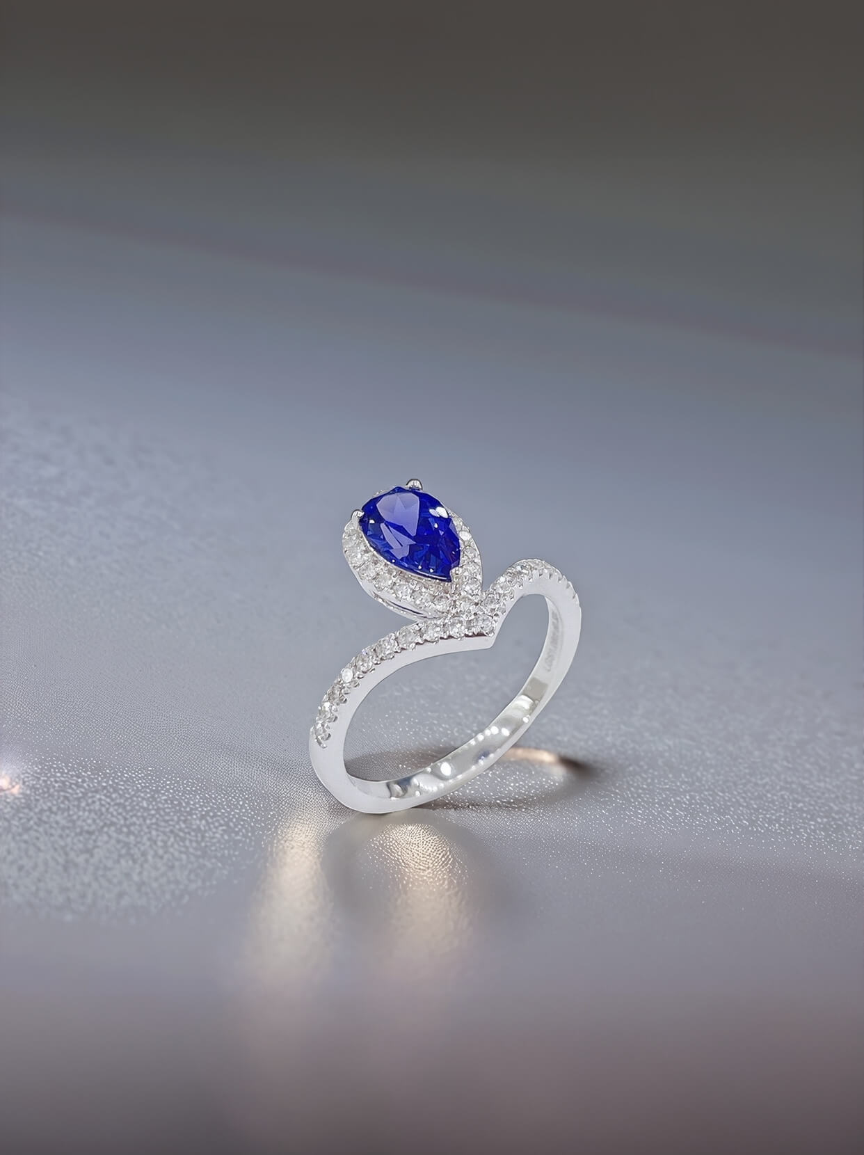 Halo setting pear cut  lab grown sapphire engagement ring