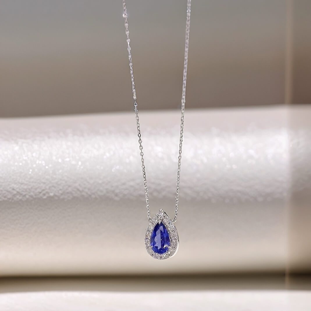 Halo setting pear cut lab grown sapphire pendant necklace