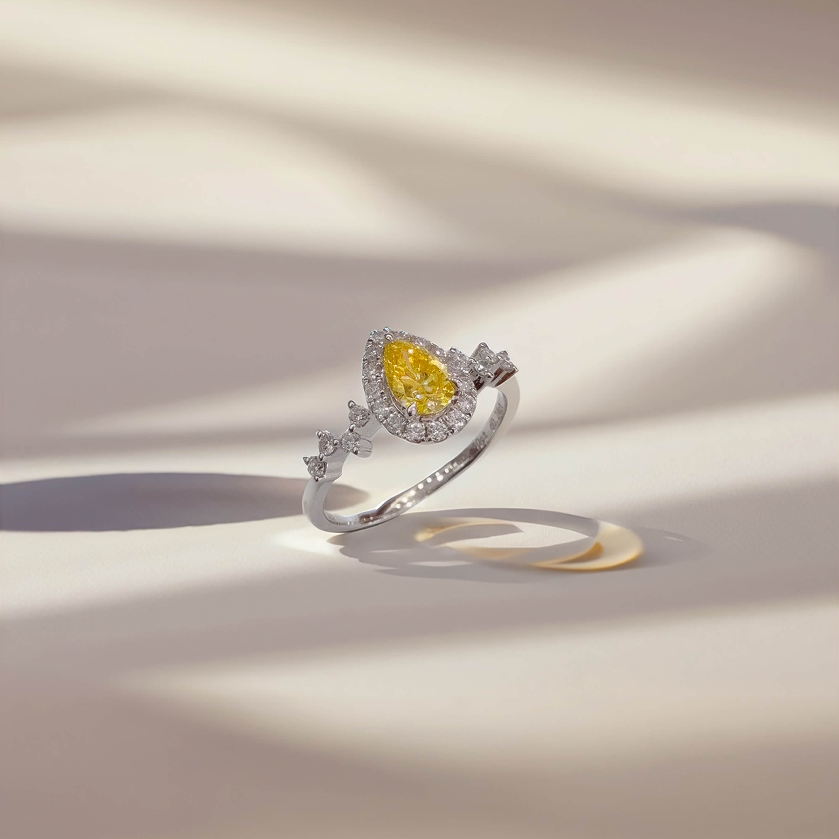 Halo setting pear cut lab grown yellow diamond engagement ring