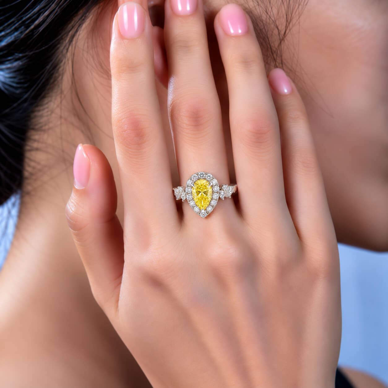 Halo setting pear cut lab grown yellow diamond engagement ring