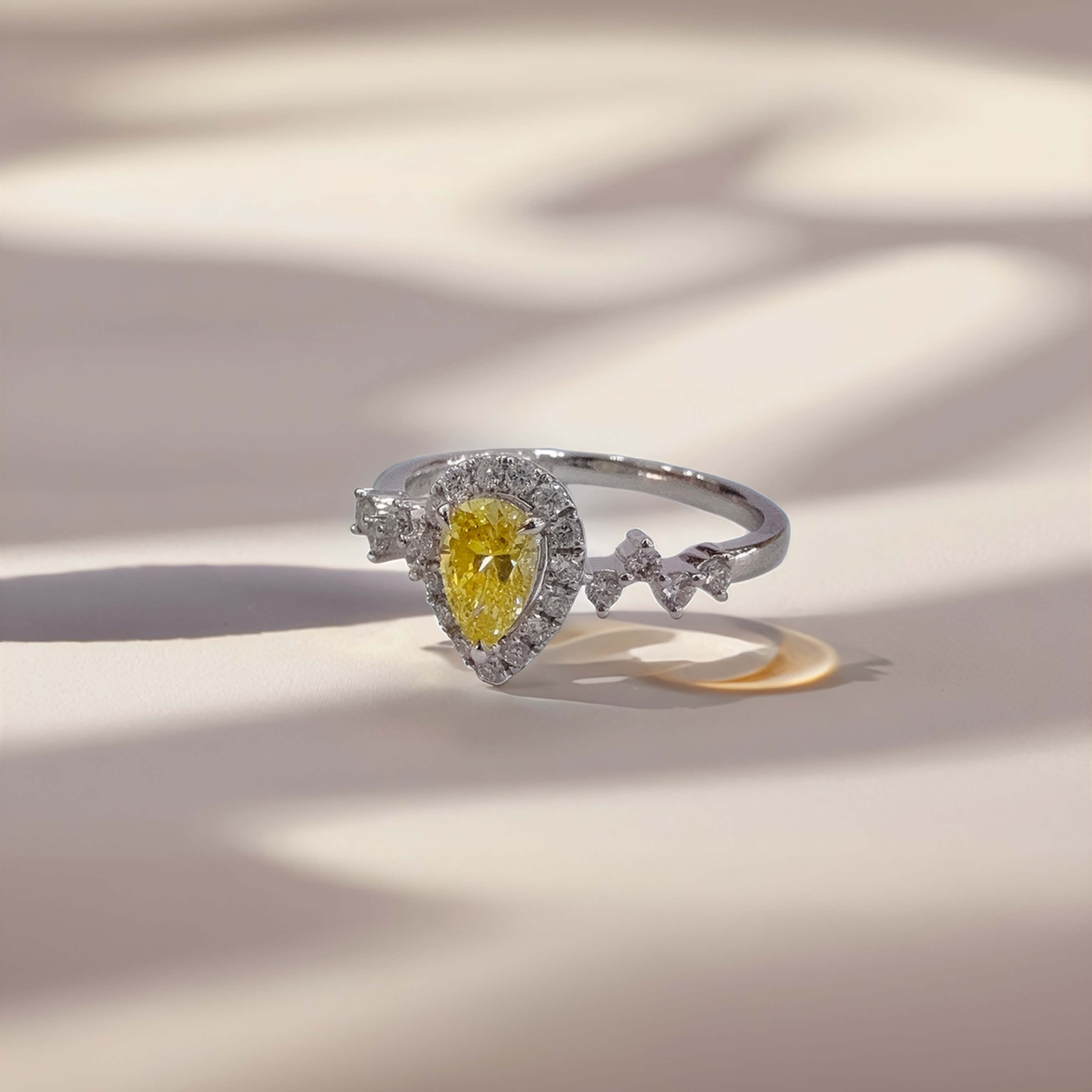 Halo setting pear cut lab grown yellow diamond engagement ring