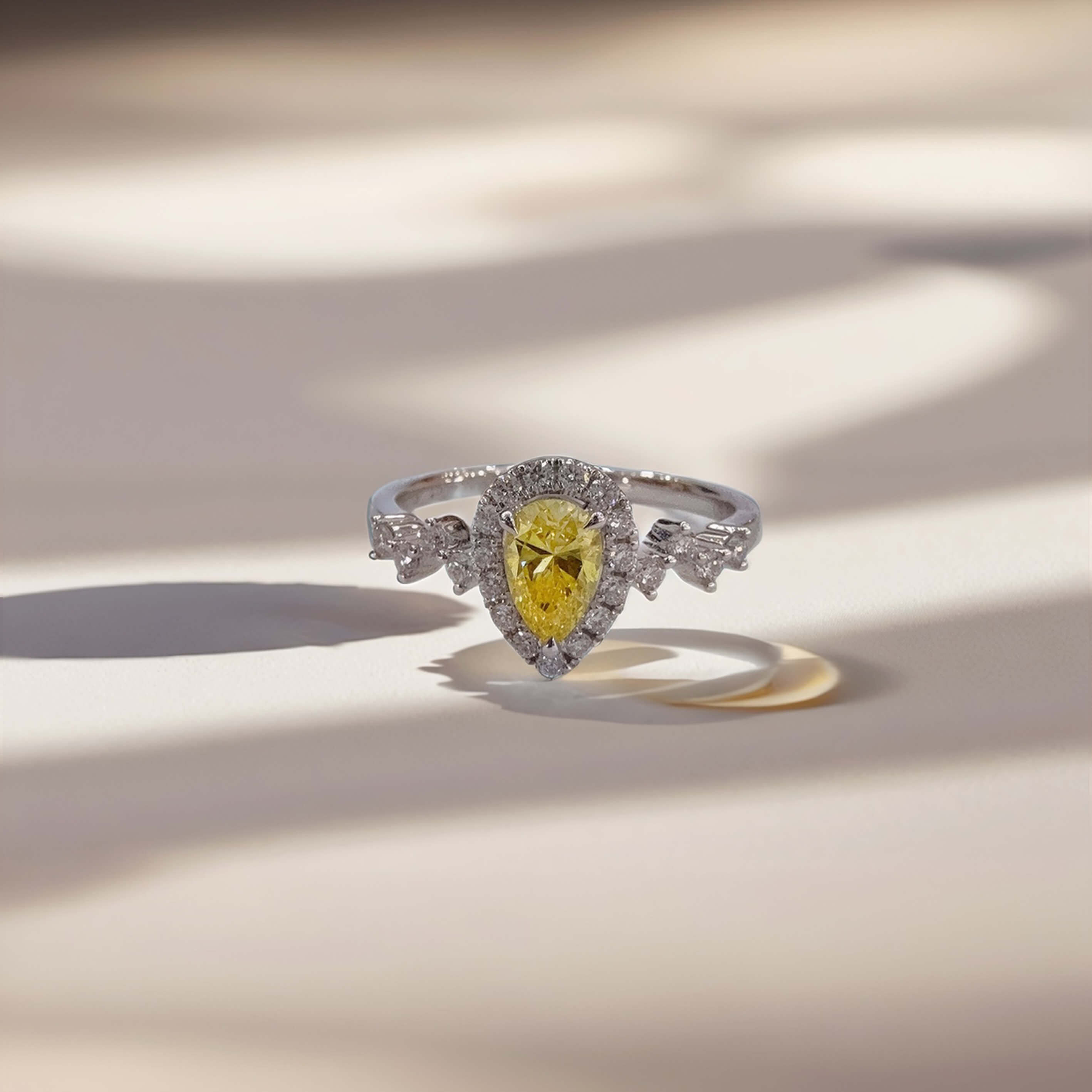Halo setting pear cut lab grown yellow diamond engagement ring