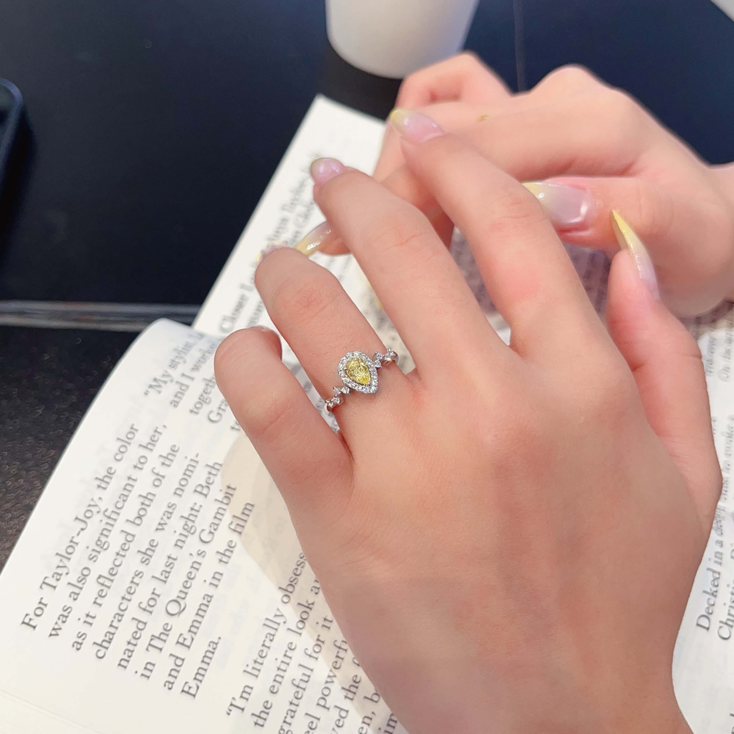 Halo setting pear cut lab grown yellow diamond engagement ring