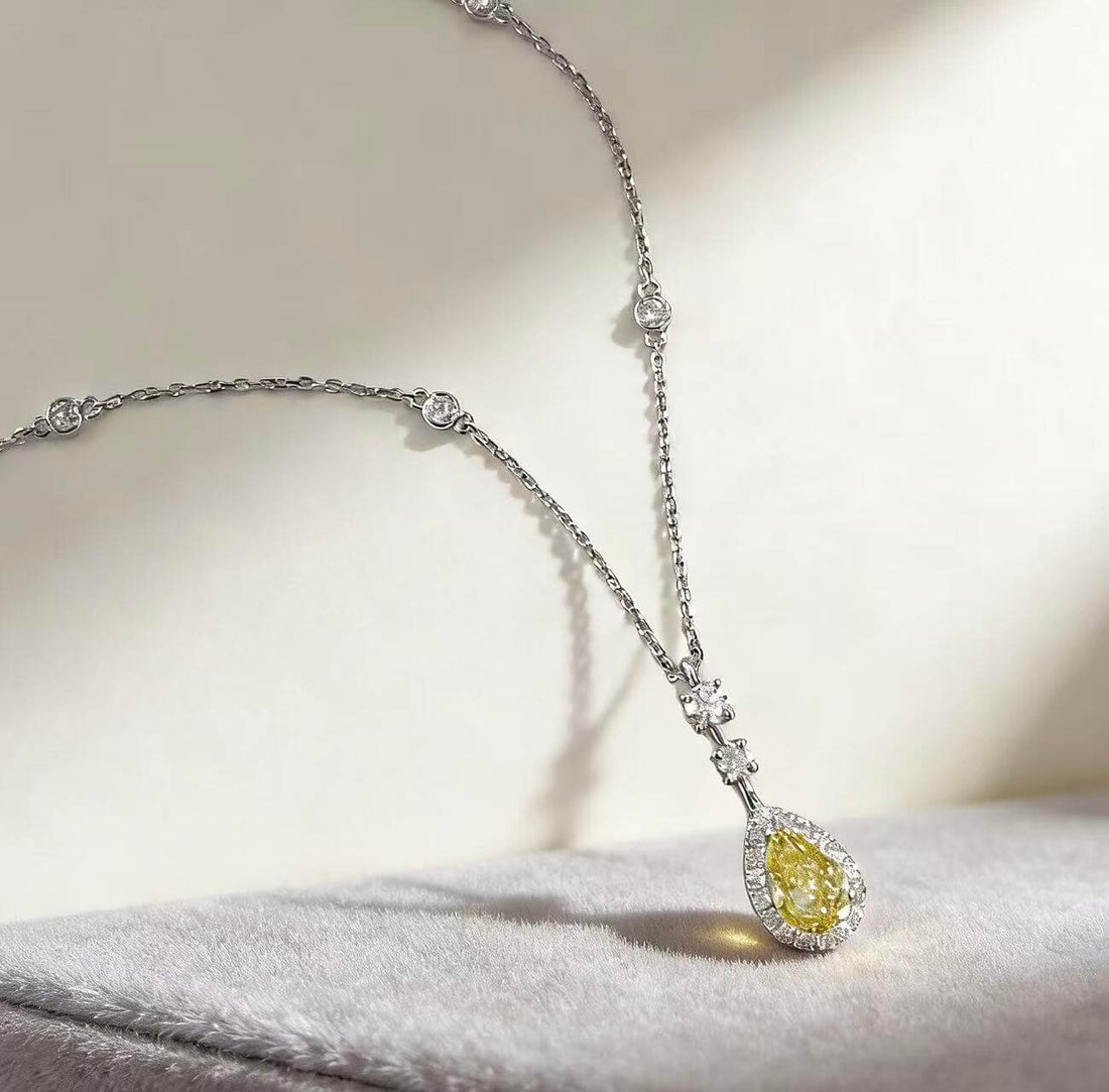 Halo setting pear cut lab grown yellow diamond necklace