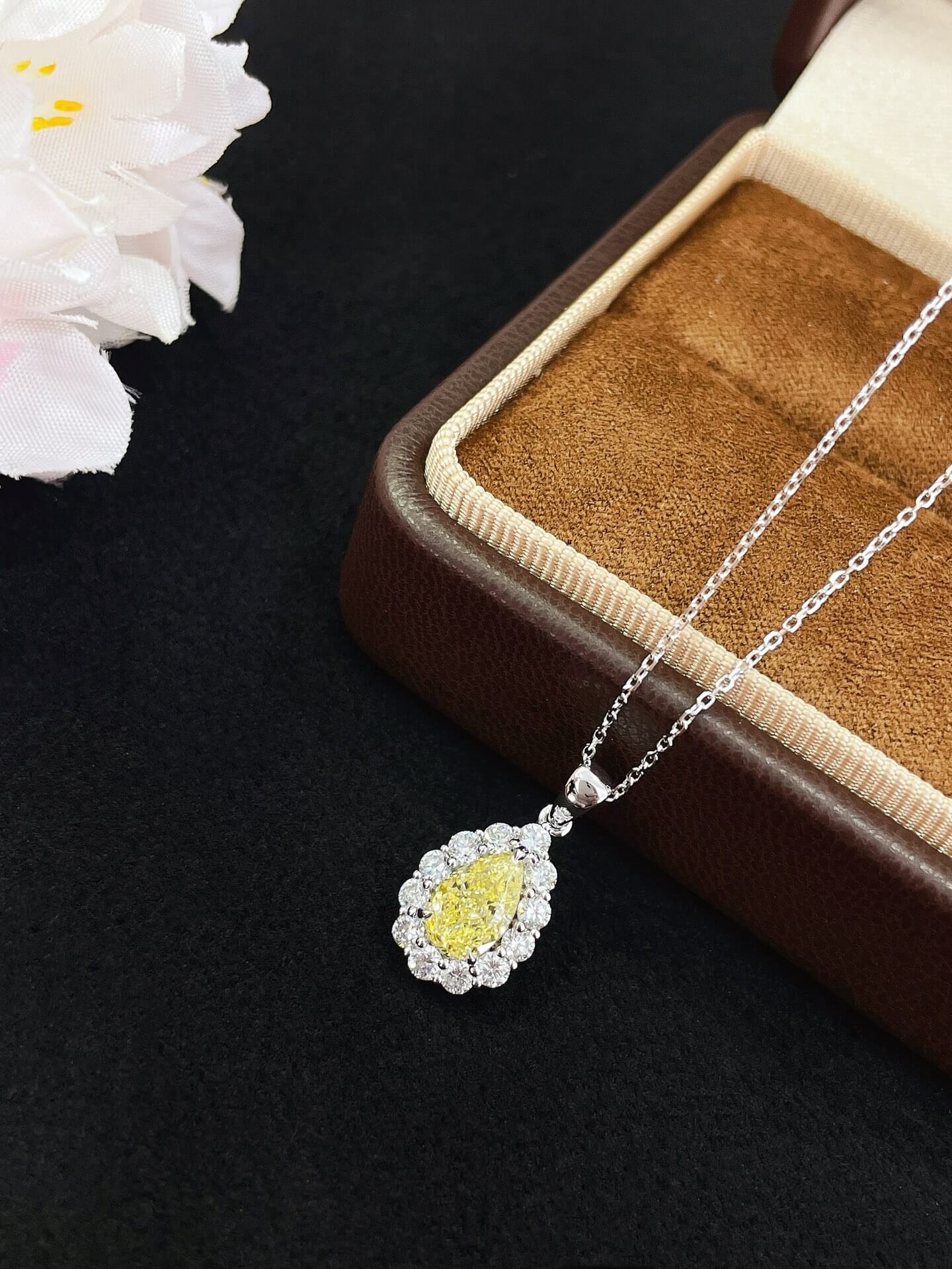 Halo setting pear cut lab grown yellow diamond pendant necklace