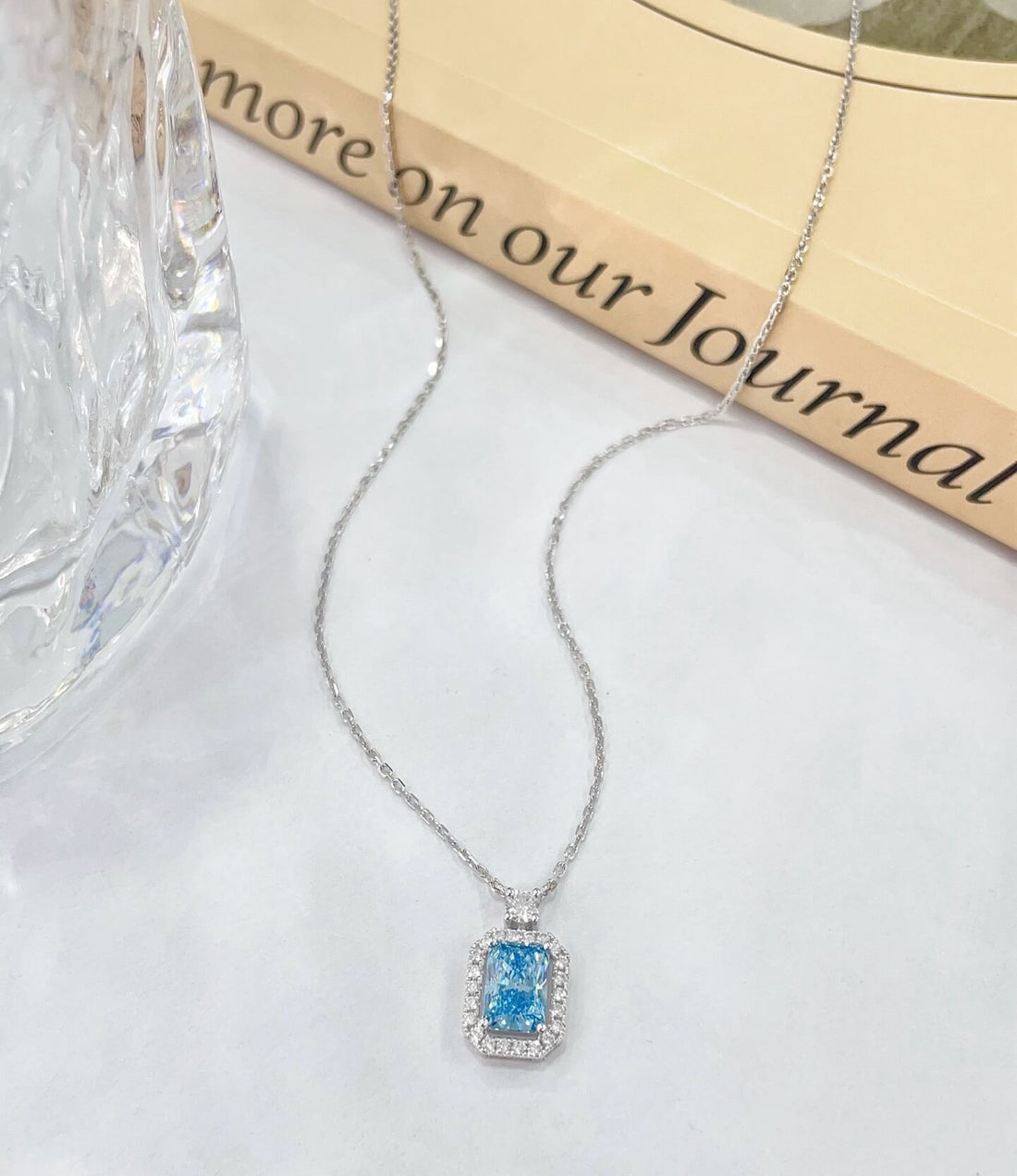 Halo setting radiant cut lab grown blue diamond necklace