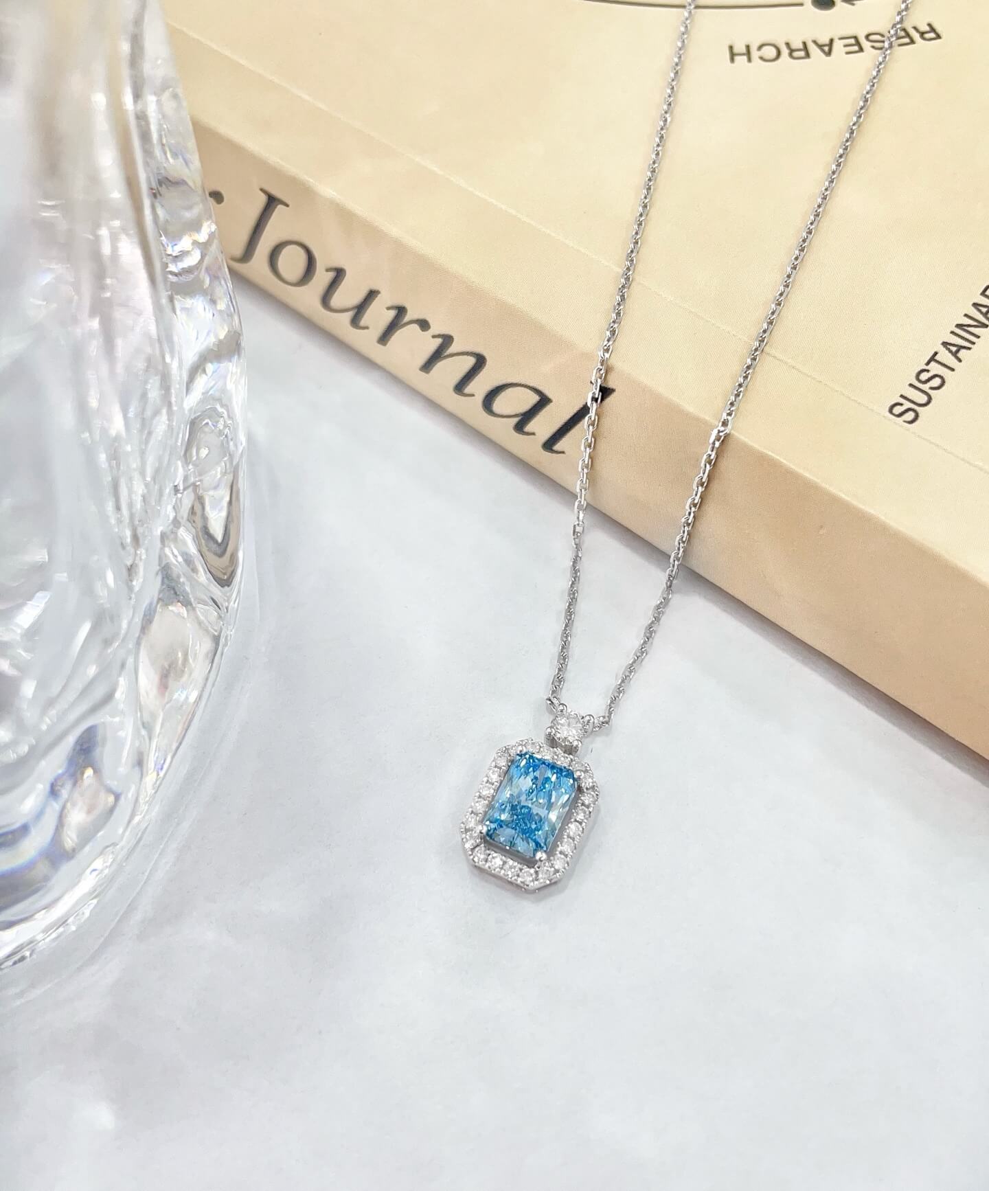 Halo setting radiant cut lab grown blue diamond necklace